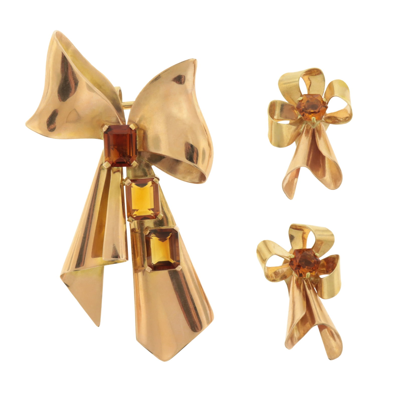Retro Rose Gold & Citrine Bow Brooch and Earclips: 14 karat rose gold bow-form brooch with three central emerald cut citrines, together with a pair of 14 karat yellow gold and rose gold bow-form earclips with central octagonal brilliant cut citrines. 
