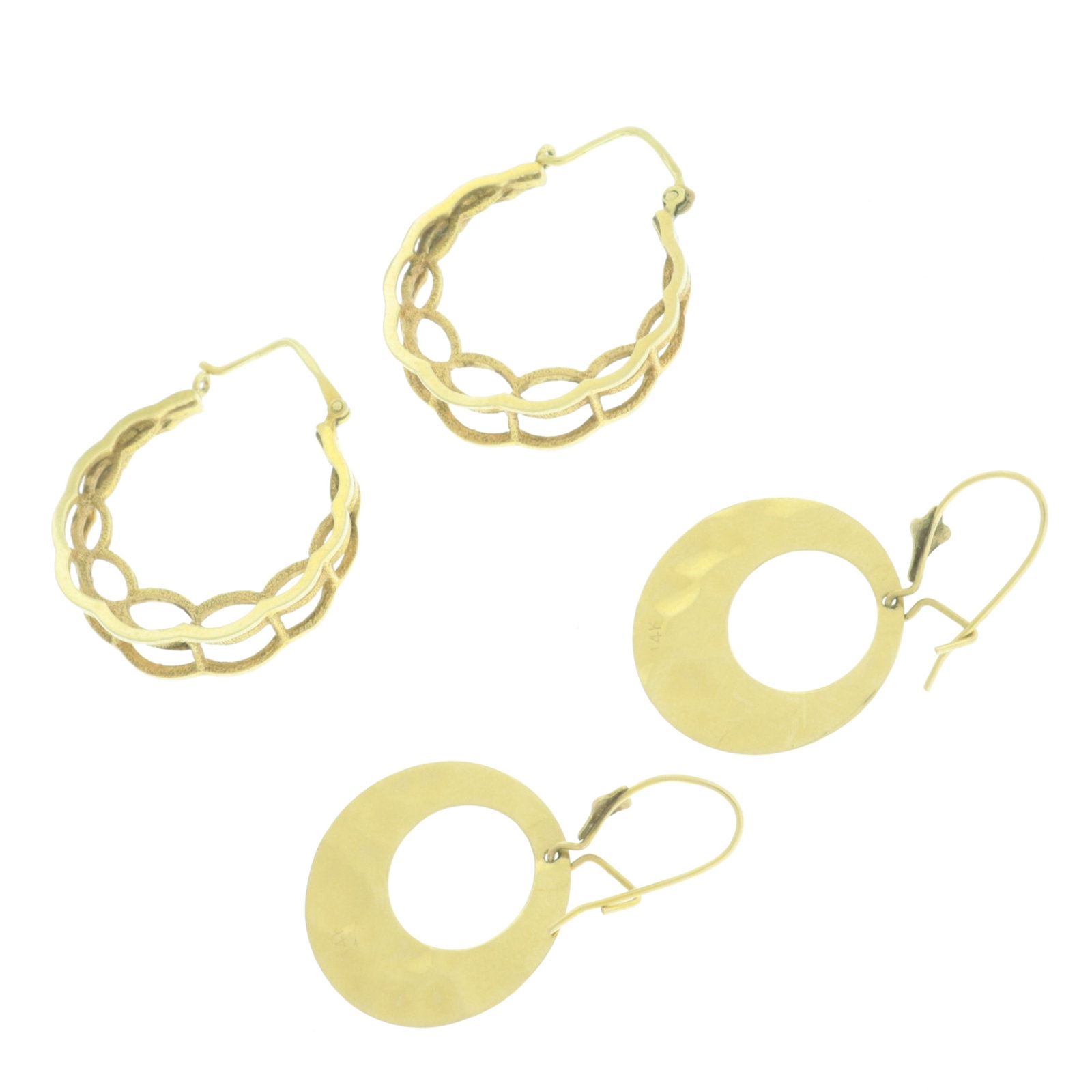 Two Pairs of Retro 14K Yellow Gold Earrings: Two pairs of retro 14 karat yellow gold earrings. Comprising: pair of hammered motif open circles and pair of double scalloped hoops. Weighing 5.6 grams. 7/8" diameter and 3/4" diameter Property from 