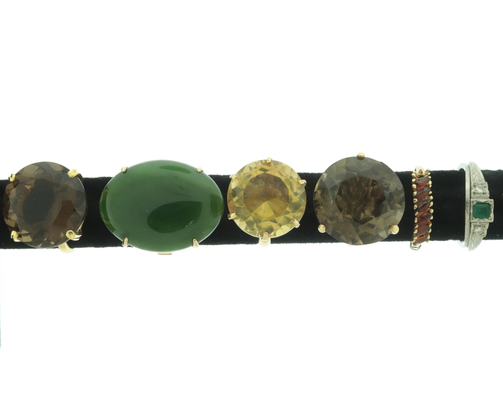 Group of 14K Gold and Gem-Set Rings: A group of vintage 14 karat yellow and white gold cocktail rings. Comprising: 14 karat yellow gold ring with ~10 ct round citrine, 14 karat yellow gold ring with ~14 ct round smoky quartz, 14 karat ye