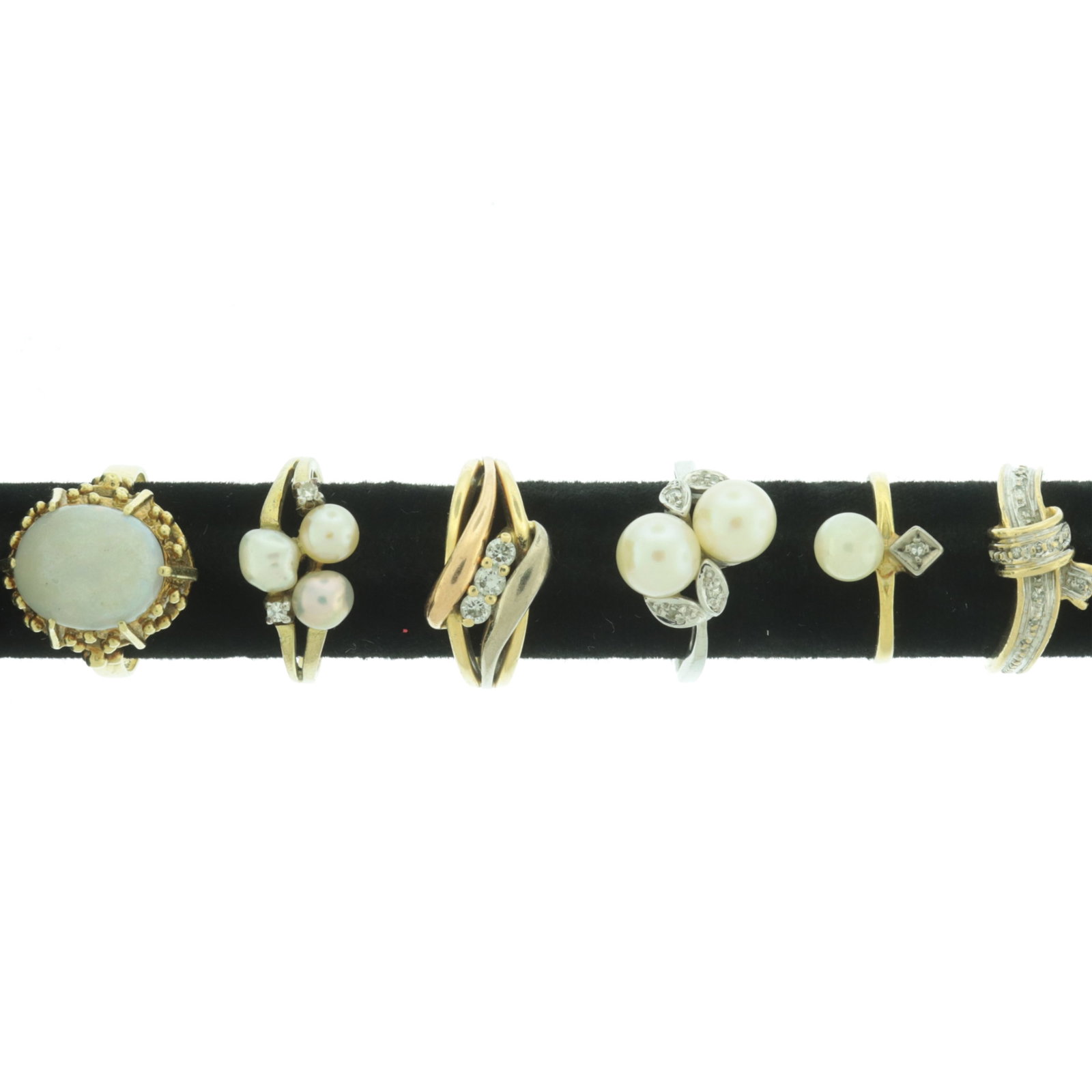 Group of Gold and Gem-Set Rings: Grouping of vintage 14 karat and lower karat gold rings. Comprising: 14k yellow gold brutalist style with faux opal, 14k yellow, rose, and white gold crossover ring with three round diamonds, 14k yell