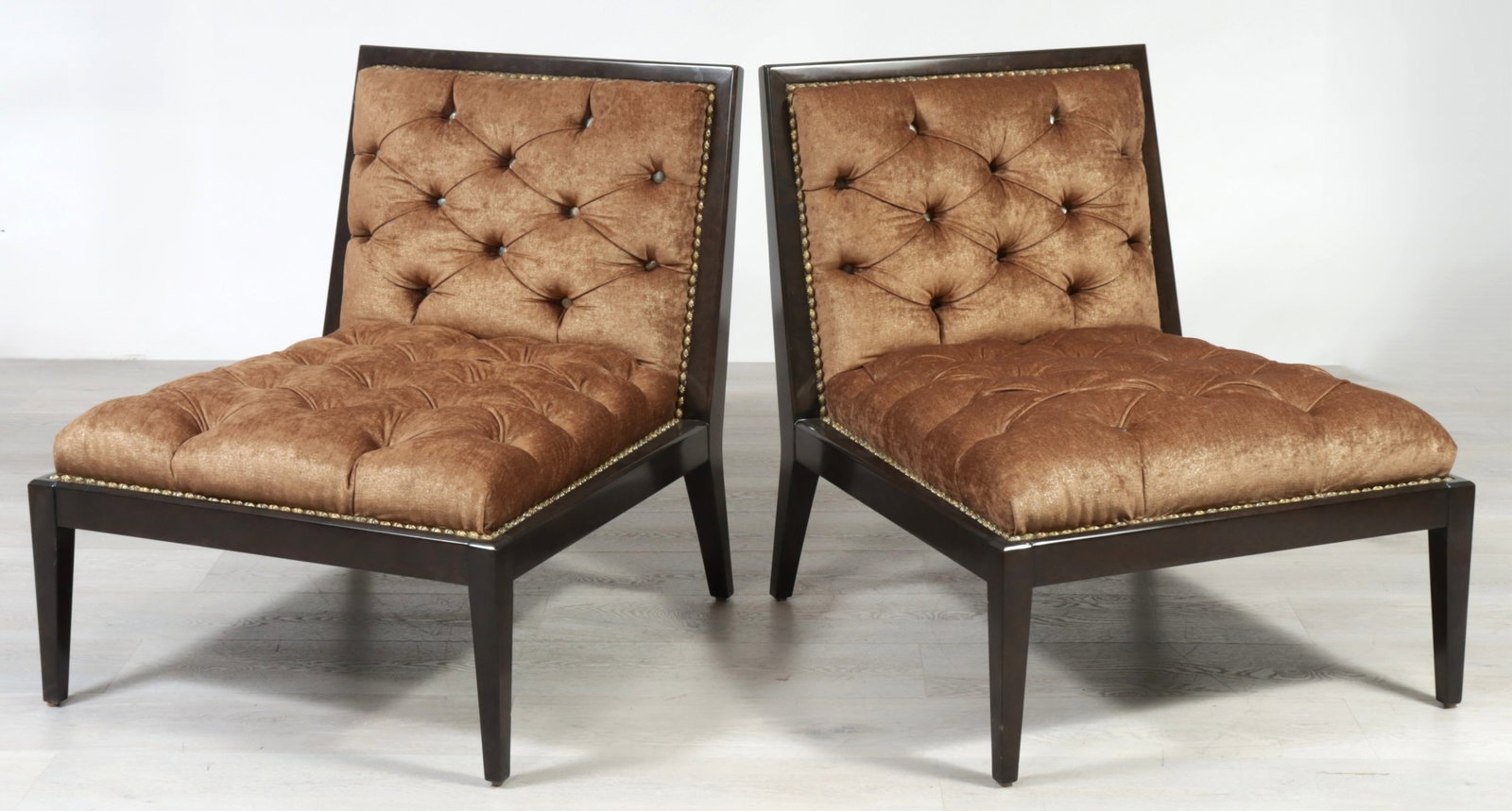 Pair of Marge Carson Greenwich Chairs: Pair of Marge Carson 'Greenwich' slipper chairs, dark stained oak frames with tufted bronze fabric upholstery. 26.5" H x 17" W x 12.5" D