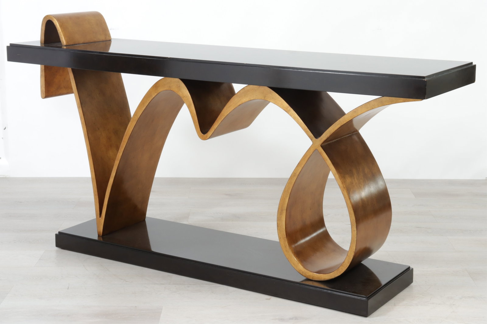 Marge Carson Bolero Console Table: Marge Carson Bolero collection walnut and gilded ribbon form console table. 36" H x 76" W x 18.5" W