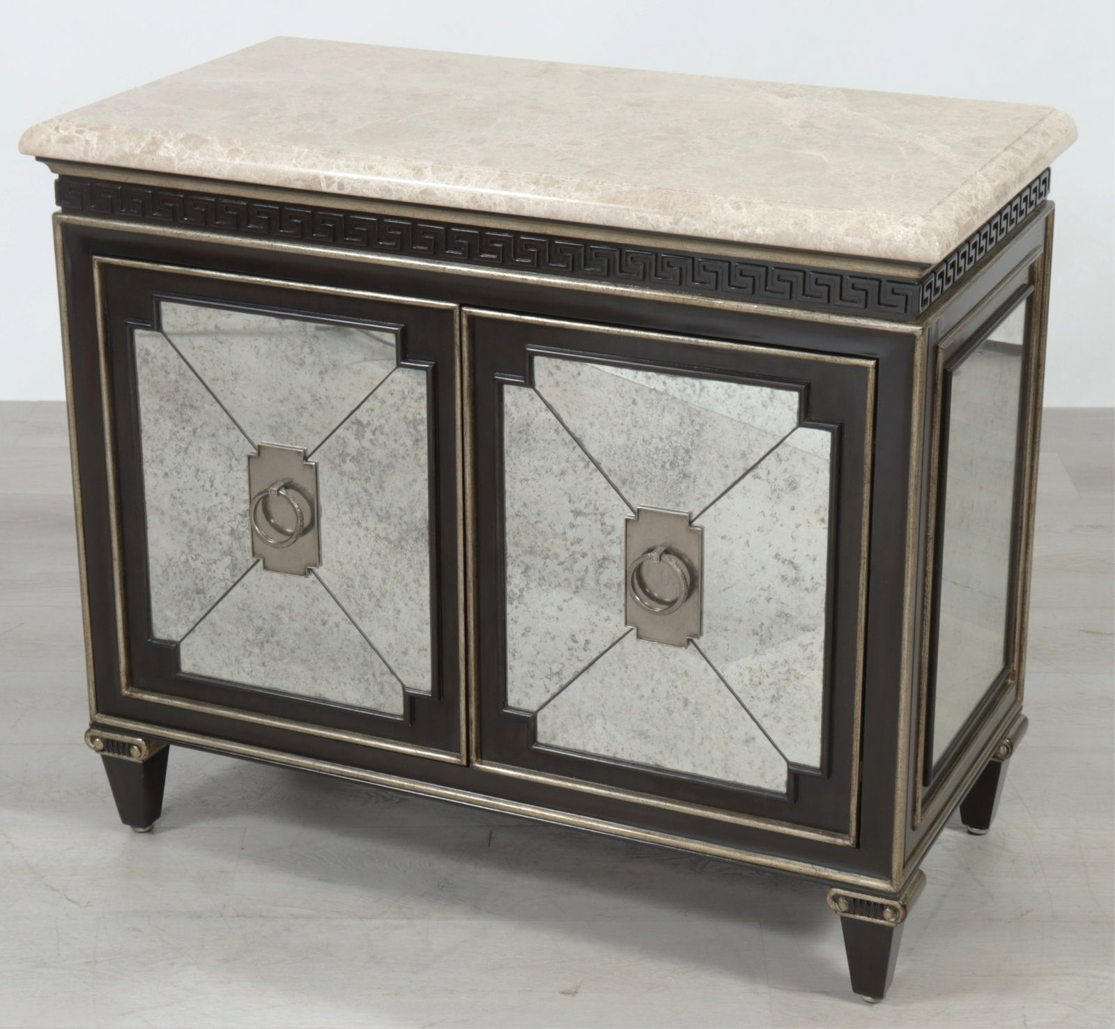 Marge Carson Mirrored Cabinet: Marge Carson antiqued mirrored cabinet, Greek key frieze, marble veneered top. 34.75" H x 40" W x 20" D