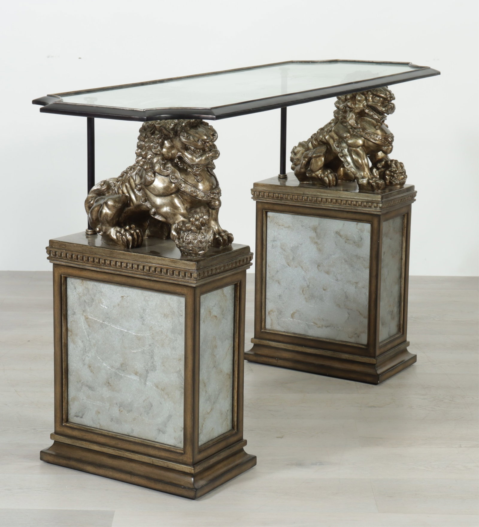 Marge Carson Cross-Channel Console: Marge Carson Cross-Channel Console, silvered fu dogs on antiqued mirrored and walnut supports with glass top. 36" H x 60" W x 21" D