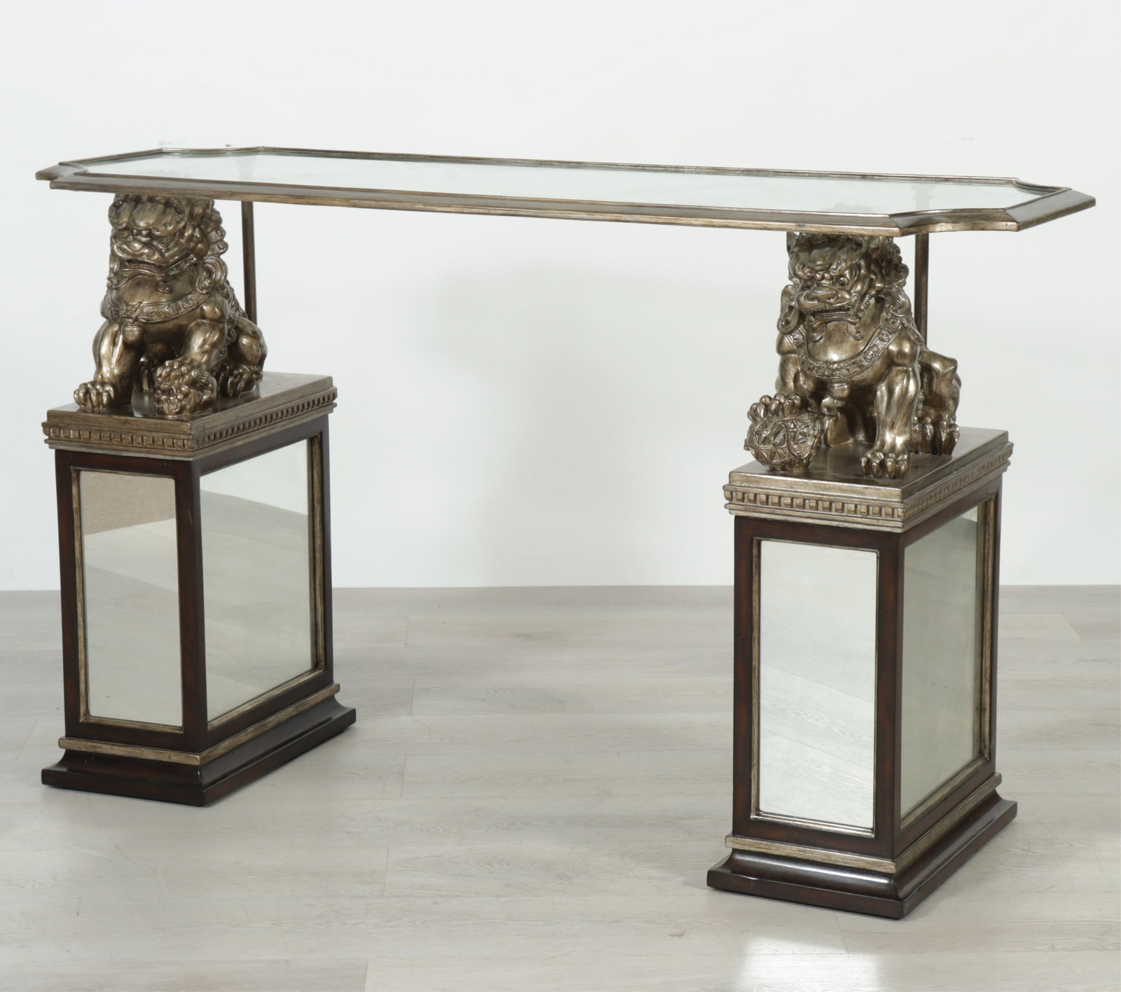Marge Carson Cross-Channel Console: Marge Carson Cross-Channel Console, silvered fu dogs on mirrored and walnut supports with glass top. 36" H x 60" W x 21" D