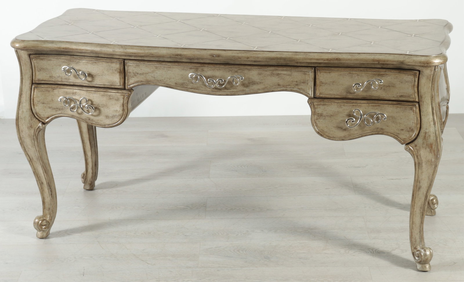 Marge Carson Rivoli Writing Desk: Marge Carson Rivoli writing desk, five drawers, distressed silvered finish with regency star finished top. 30.5" H x 60" W 23.5" D