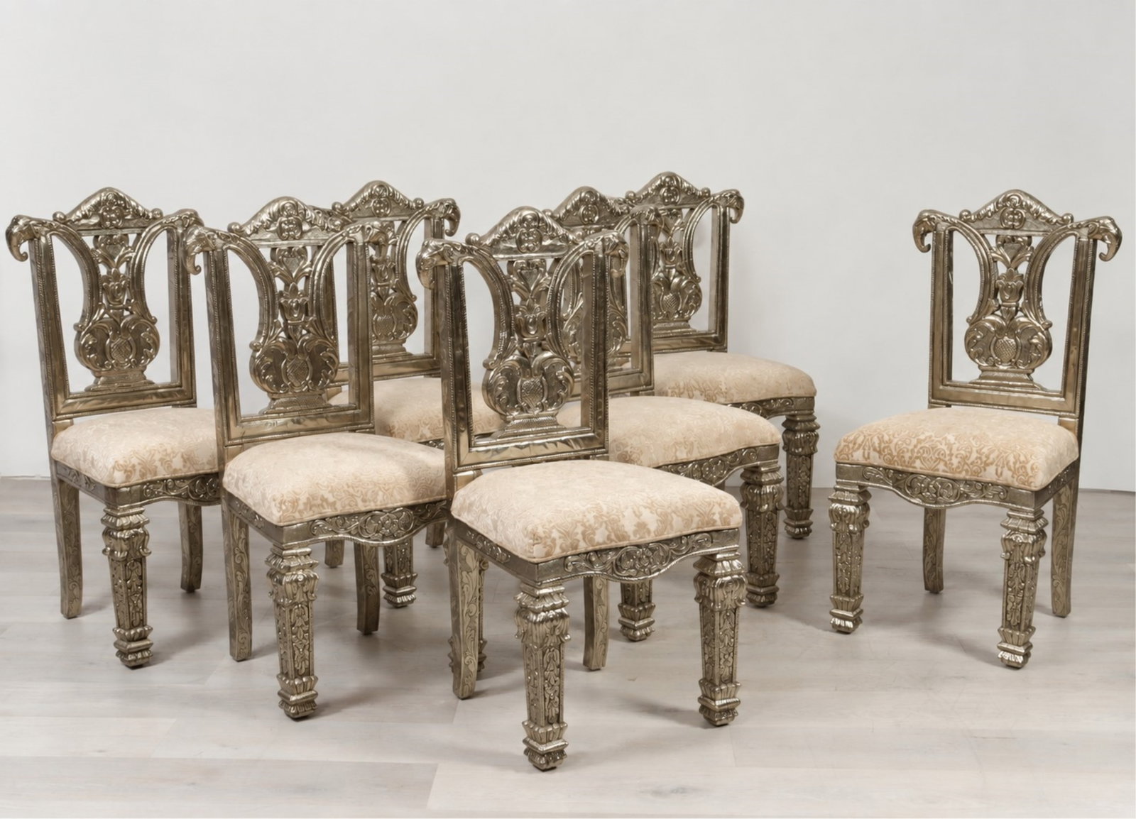 8 Indian Repousse Brass Veneered Dining Chairs: Set of 8 Indian Repousse Brass Veneered Dining Chairs, in platinum cut velour upholstery 44" H x 21" W x 21" D