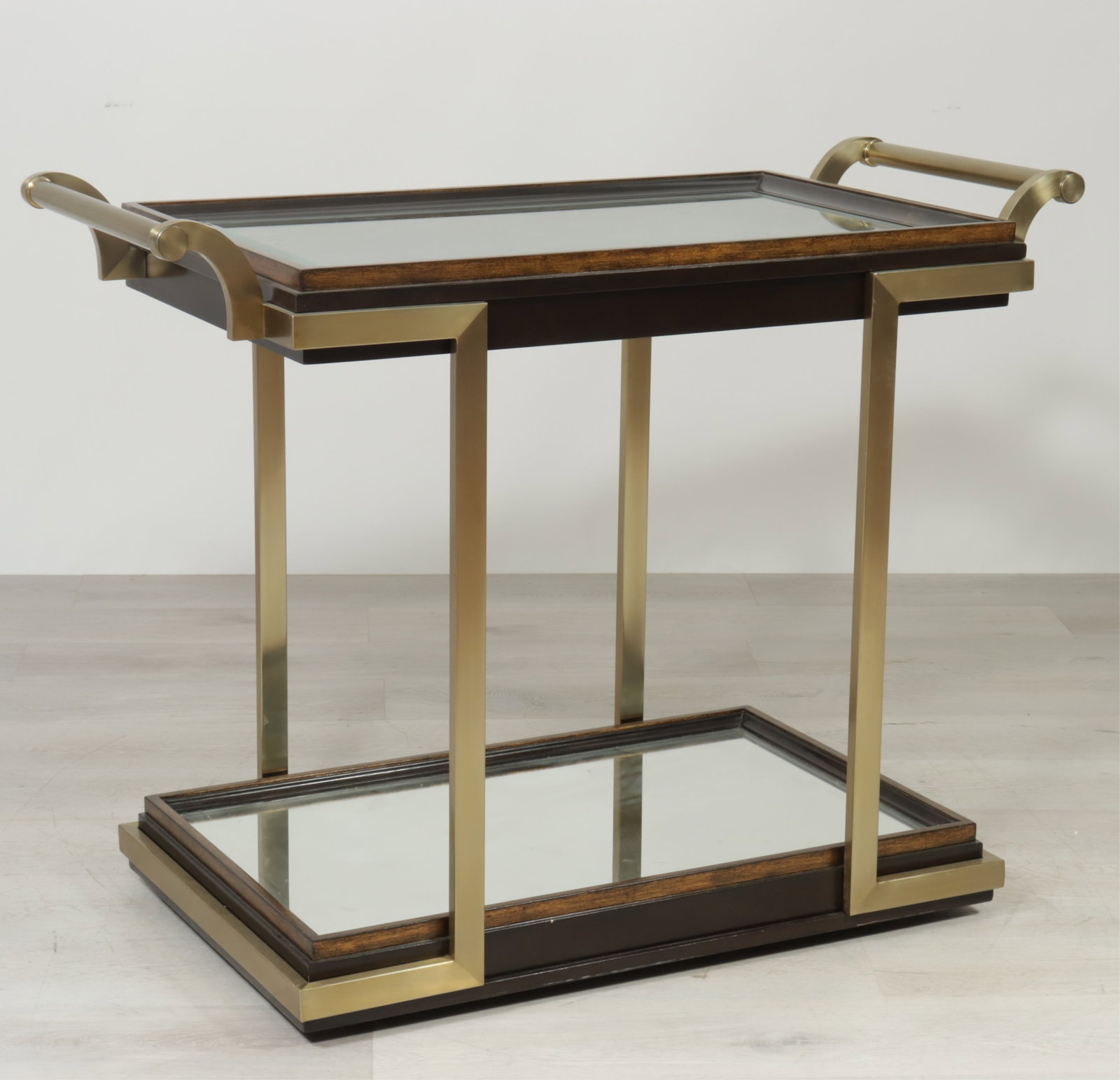 Marge Carson Malibu Bar Cart: Marge Carson Malibu Bar Cart or Serving Table, walnut wood with brass handles and supports, inset mirrored shelves, on casters. 36.75" H x 47.75" D x 24" D