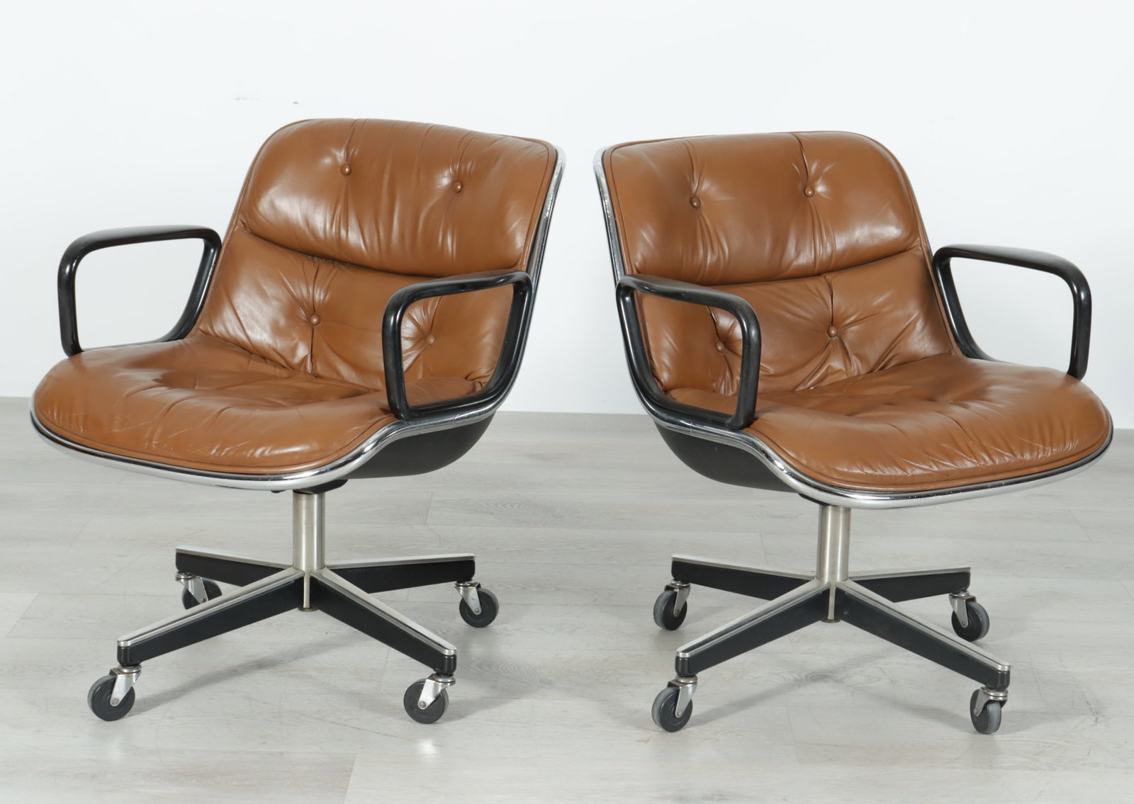 Pair Charles Pollock for Knoll Executive Chairs: Pair of Charles Pollock Executive Chairs for Knoll International, Inc., c.1974, tan leather tuft upholstered, chrome plated steel, chrome base, sturdy casters, label adhered at base, dated August 1,
