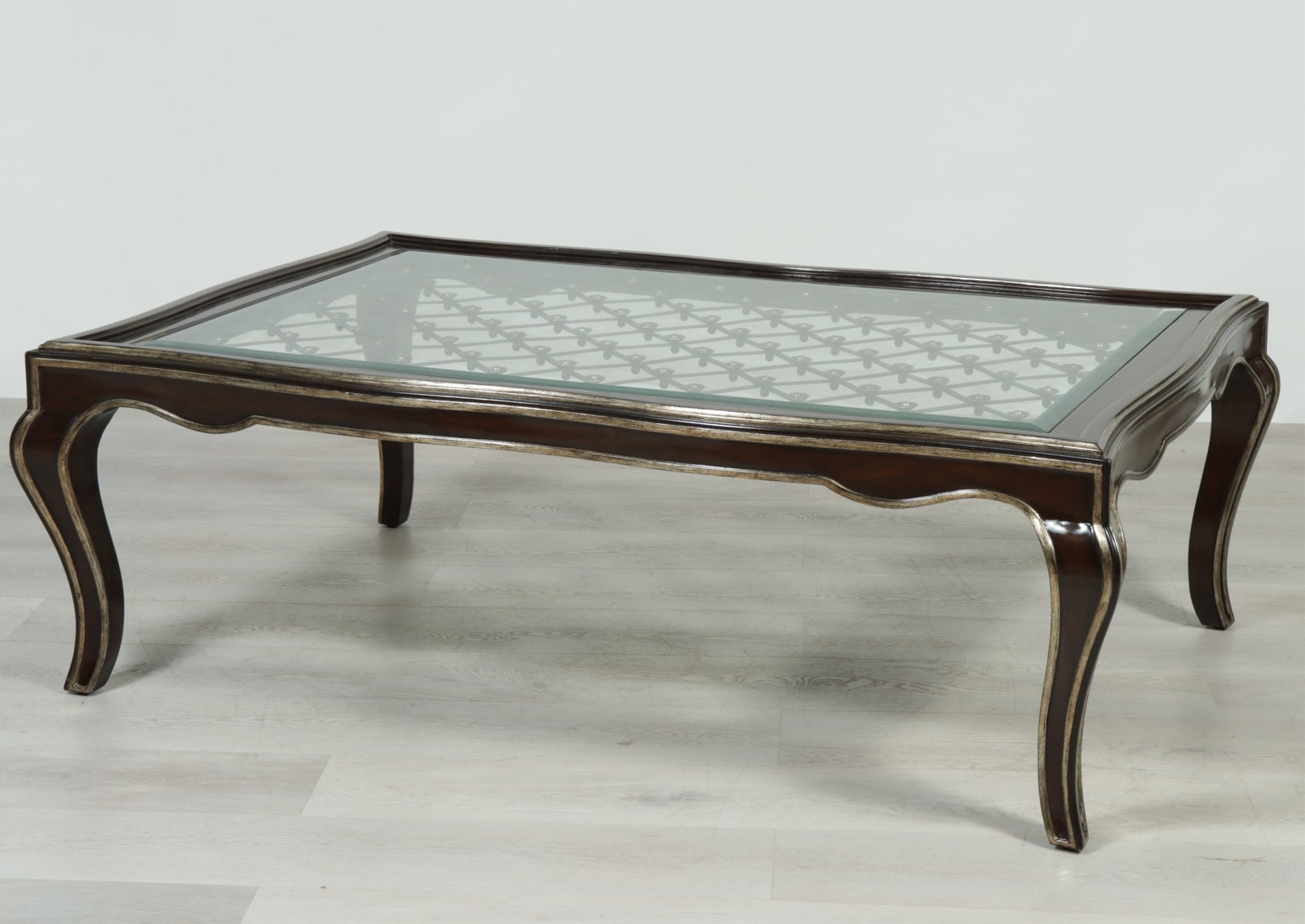 Marge Carson Cocktail Table: Marge Carson cocktail table. Silvered details throughout, inset glass top with metal latticework. 22.5" H x 60" W x 41" D
