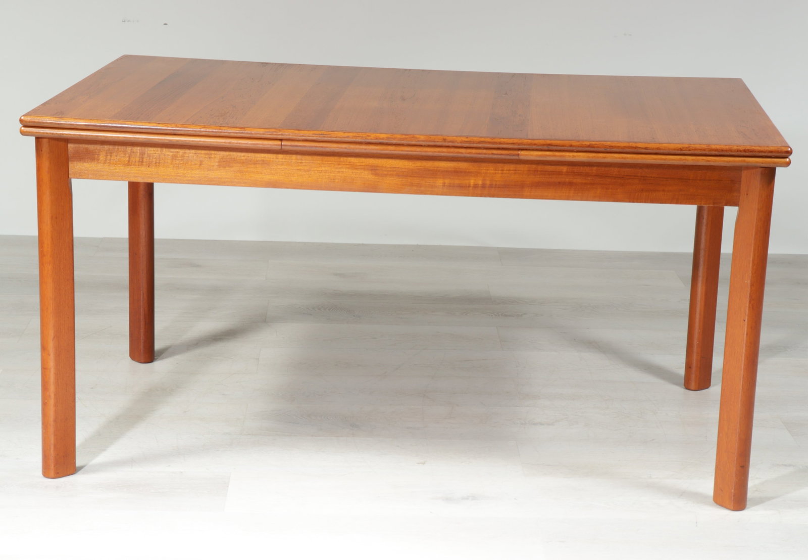 Mid Century Teak Draw-leaf Dining Table: Mid Century Modern Teak Draw-leaf Dining Table, possibly by Scandinavian Woodworks Co. 29.25" H x 35.5" W x 57.25" L, extended 97.75"