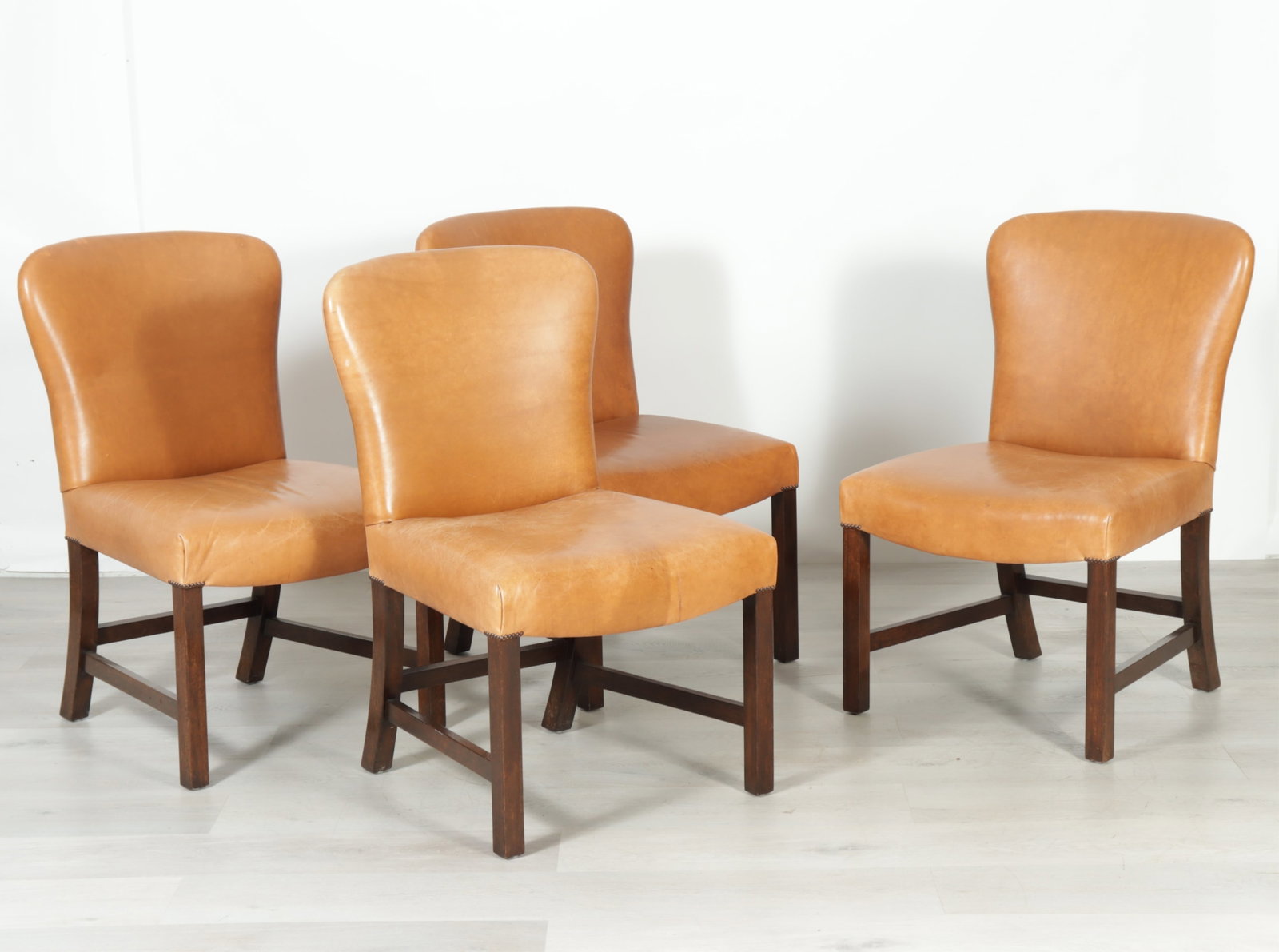 Set of 4 George III Style Mahogany Dining Chairs: Set of 4 George III style mahogany dining chairs upholstered in brown leather. 37.5" H x 22.5" W x 25" D