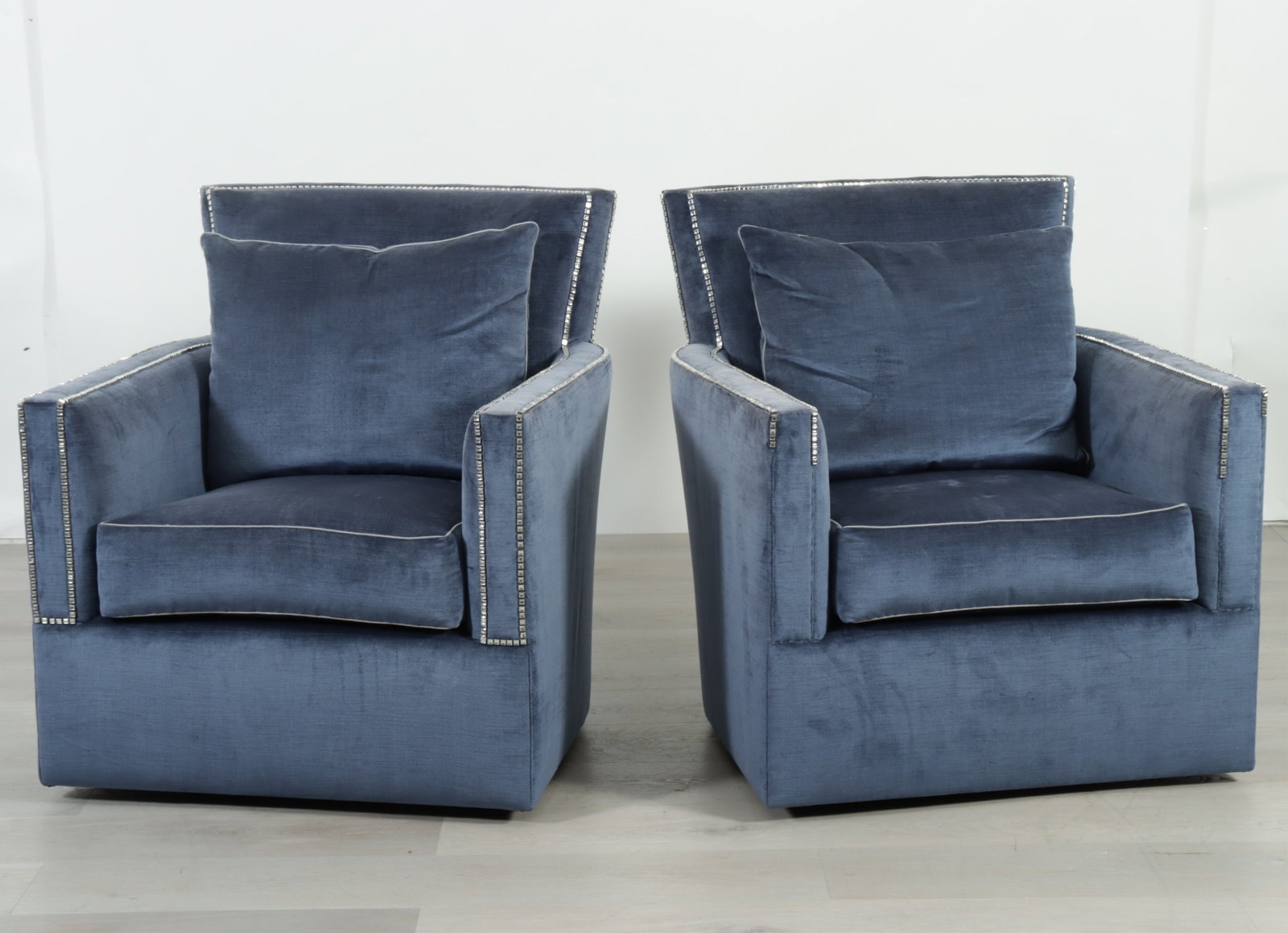 Pair Marge Carson Santa Barbara Armchairs: Pair Marge Carson Santa Barbara swivel armchairs upholstered in a rhinestone tacked blue velour. 38.25" H x 33" W x 39" D