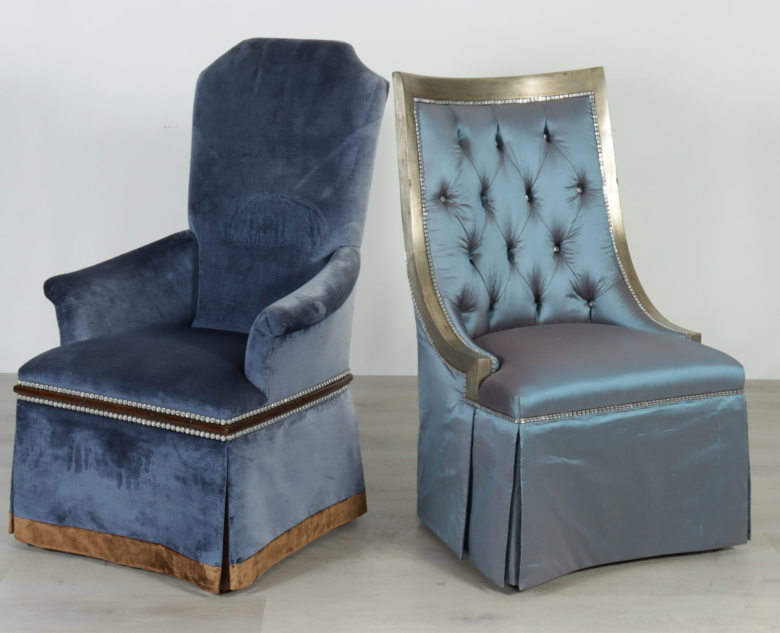 Two Marge Carson Vanity Chairs: Two Marge Carson vanity chairs in blue rhinestone tacked upholstery. 47" H x 29" W x 29" D