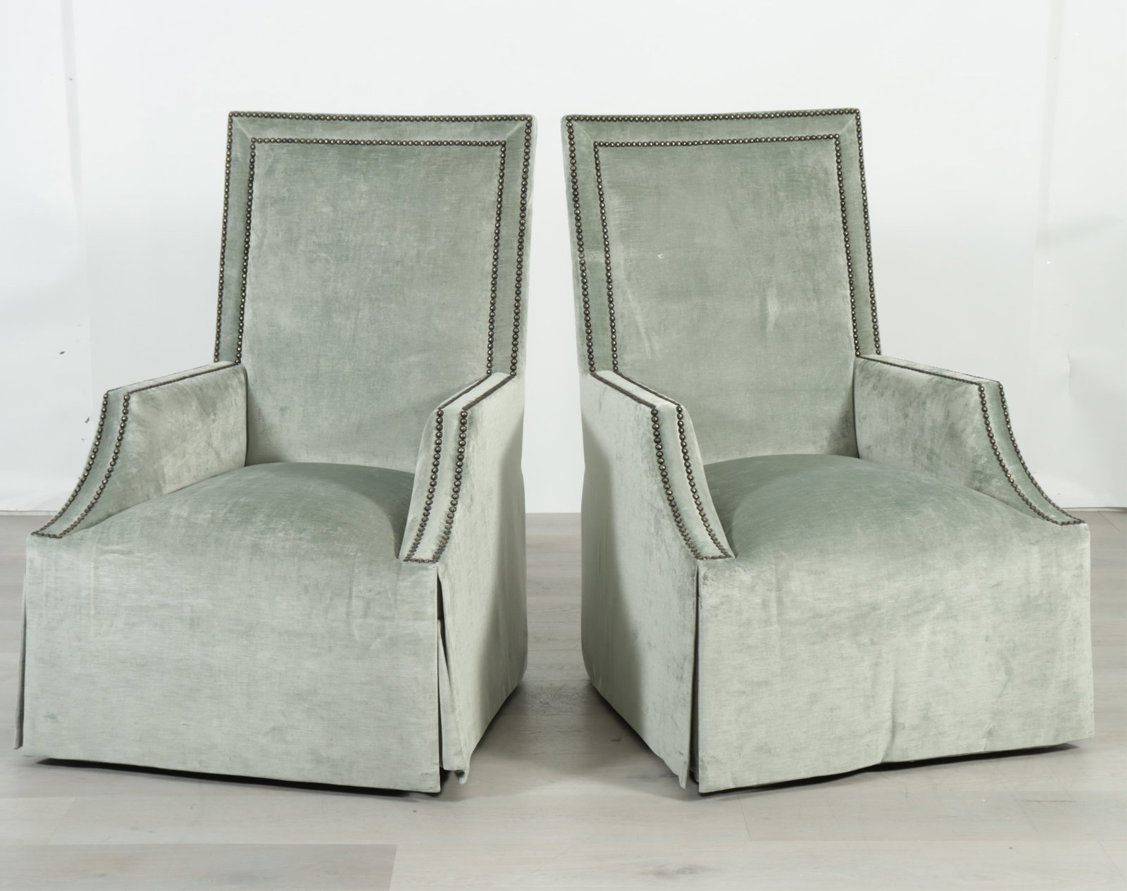 Pair Marge Carson Blair Armchairs: Pair Marge Carson Blair swivel armchairs upholstered in a brass tacked light green velour. 48" H x 32" W x 38" W
