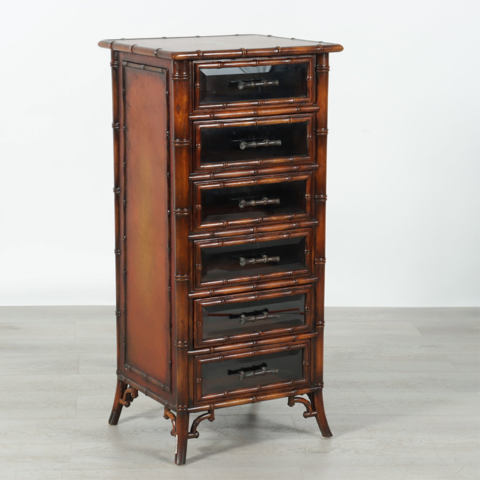 Regency Style Faux Bamboo Mahogany Tall Chest: Regency style faux bamboo mahogany tall chest of drawers with embossed leather top and beveled glass front drawers. 42.5" H x 20" W x 18" D