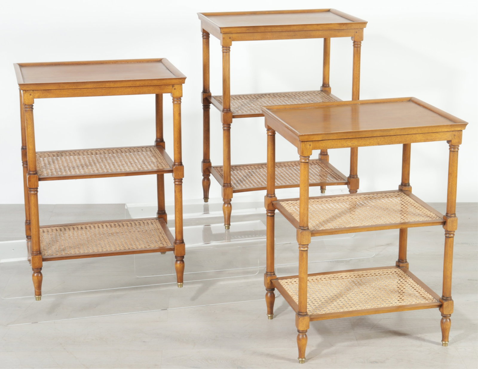 Regency Style Caned 3-Tier Side Tables: Three regency style 3-Tier mahogany and cane side tables, purchased from Pierre Deux. 29" H x 21" W x 15.75" D