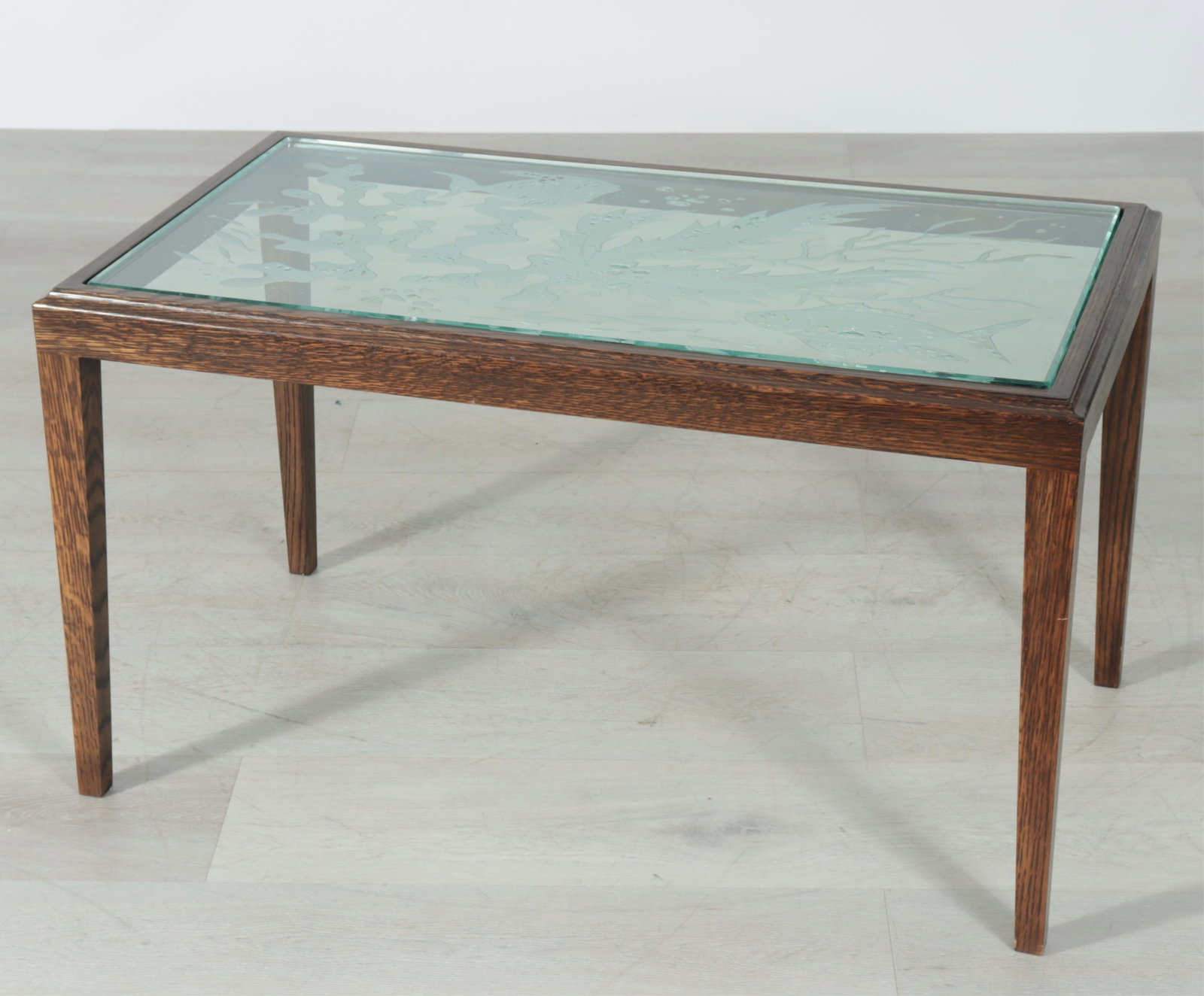Holland America Line Etched Glass Cocktail Table: Glass from Holland America Cruise Line as a cocktail table with custom wood base, molded and etched sea theme glass with fish and coral reef 20.5 H x 36 W x 20 D
