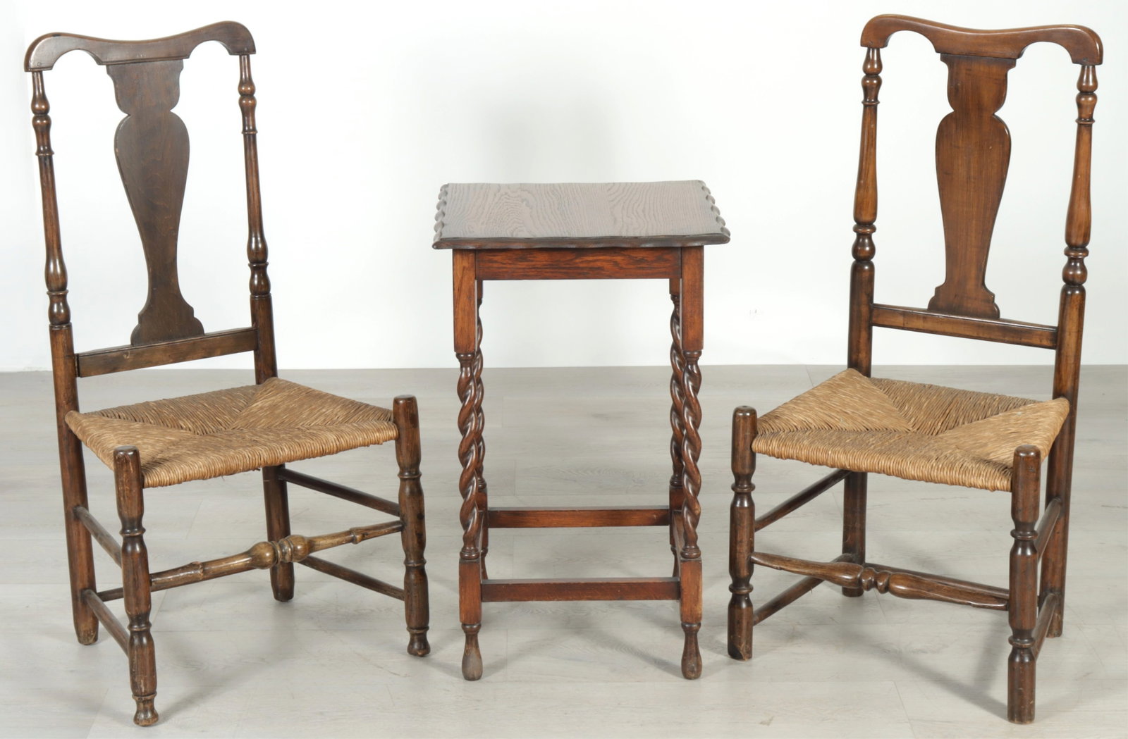 English Baroque Style Side Table & Chairs: English Baroque style oak side table together with a pair of rush seat chairs with barley twist legs. 28.5" H x 27.5" square