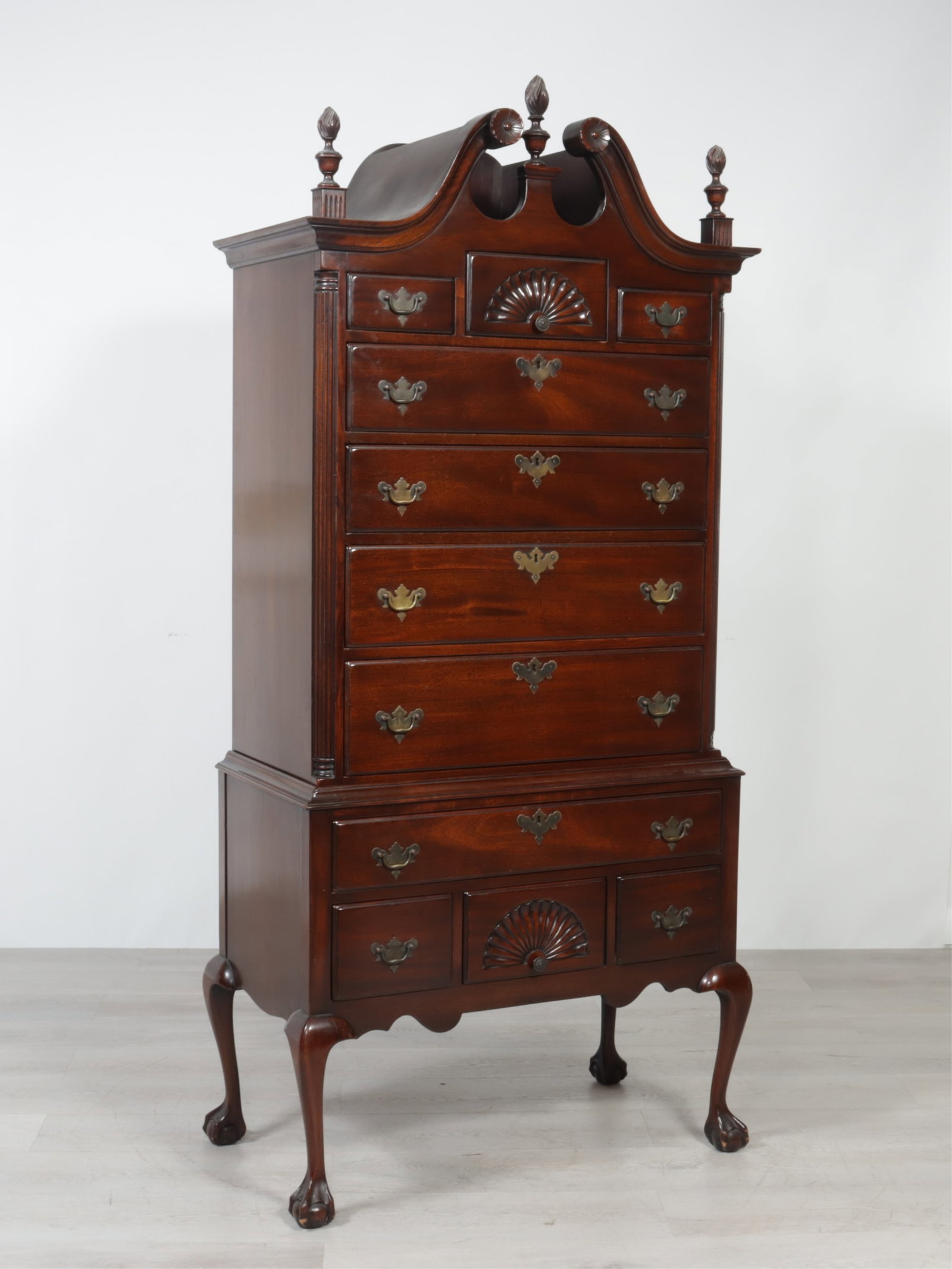 Beacon Hill Chippendale Style Highboy: Beacon Hill Chippendale style mahogany highboy, broken pediment with floral ornament, carved fan decorated drawers 76.5 H x 37 W x 21 D