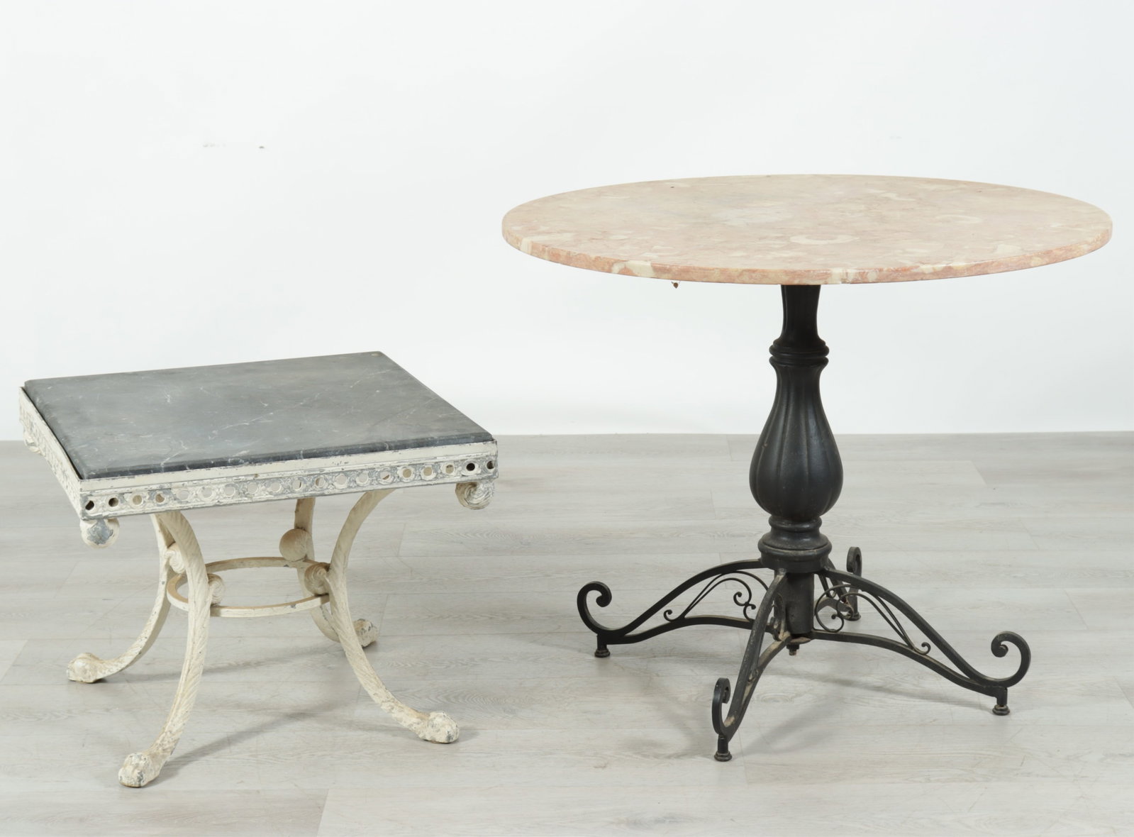 Iron Bistro Table & Side Table: Black painted iron bistro table with tan marble top, together with a white painted metal side table with black marble top. Bistro table 30" H x 36" Dia.