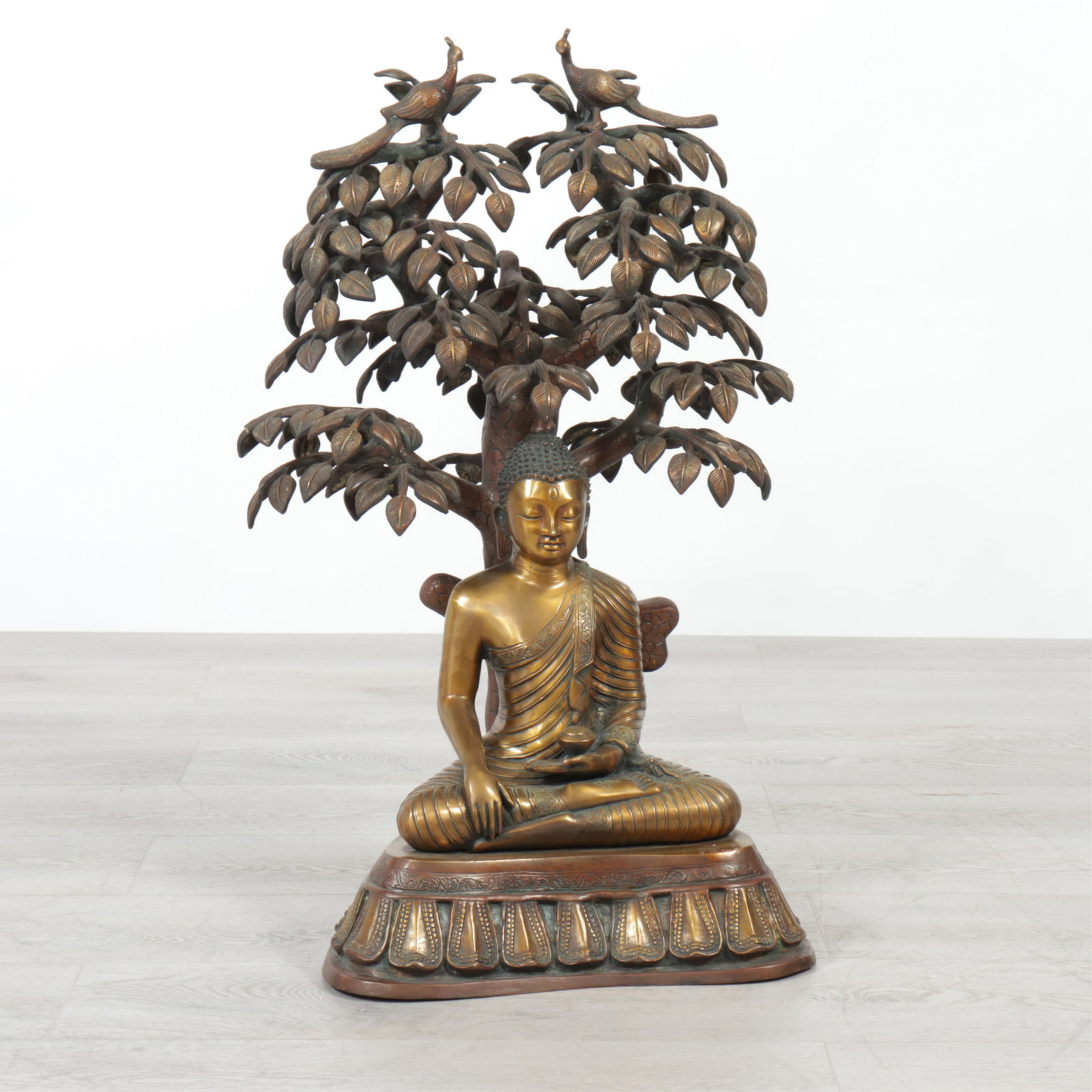 Bronze Tree of Life Buddha: A patinated bronze seated Buddha under tree of life with various birds, etc. 30.5" H x 20" W x 19" D