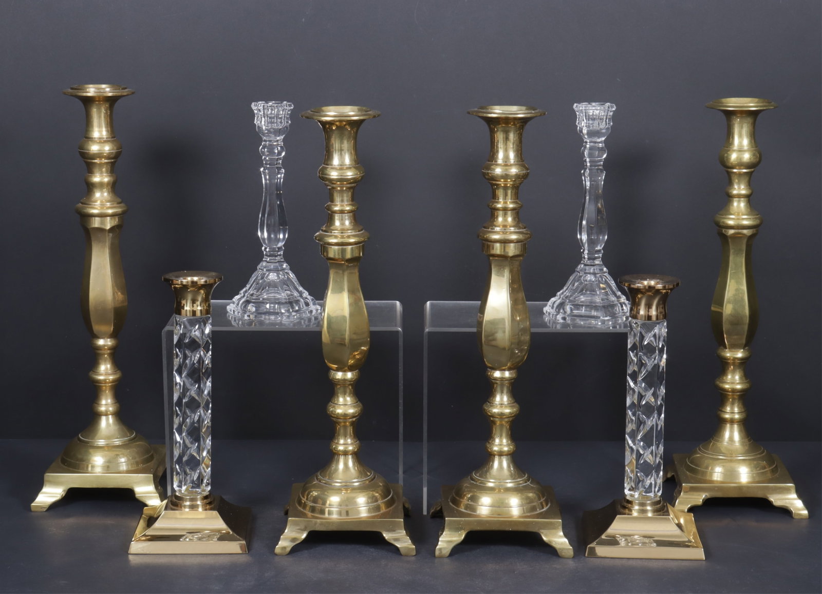 Classical Style Brass & Crystal Candlesticks: Four matching brass candlesticks, pair of Waterford crystal and brass candlesticks, and pair of Tiffany & Co crystal candlesticks. Tiffany pair 9" H, Waterford 11" H, 4 brass 17.5" H