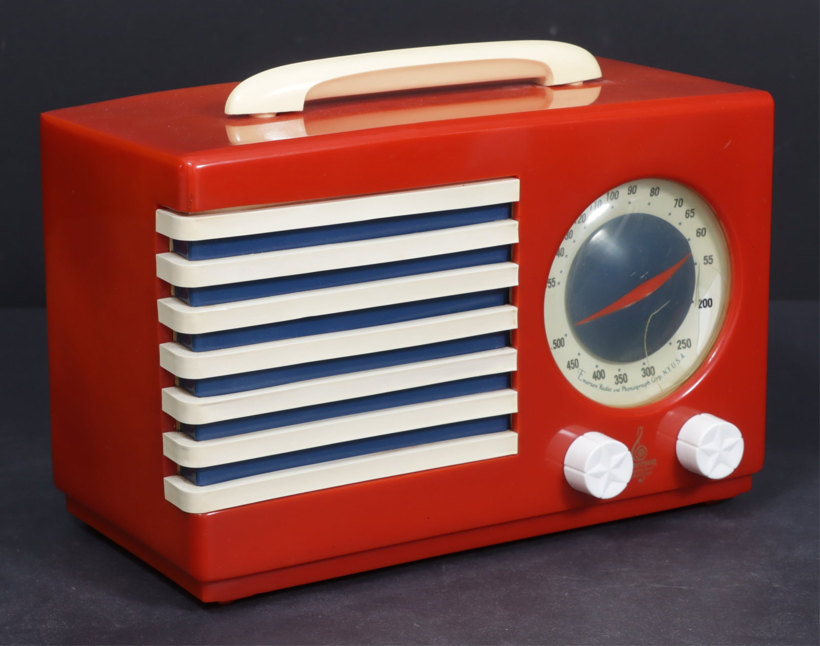 Emerson Patriot 400 Catalin Radio: Norman Bell Geddes for Emerson Radio (American, founded 1948) Catalin Radio. In a red bakelite case with white accents. 11" L x 5.25" D x 7.5" W