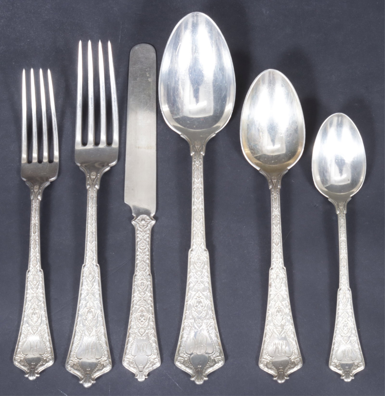 Tiffany & Co Persian Sterling Flatware, 75 pcs.: Tiffany & Co 'Persian' sterling silver flatware service for 12. Comprising: 12 dinner forks, 12 luncheon forks, 12 palace spoons, 12 tablespoons, 12 teaspoons, 12 solid knives. Serving pieces include 