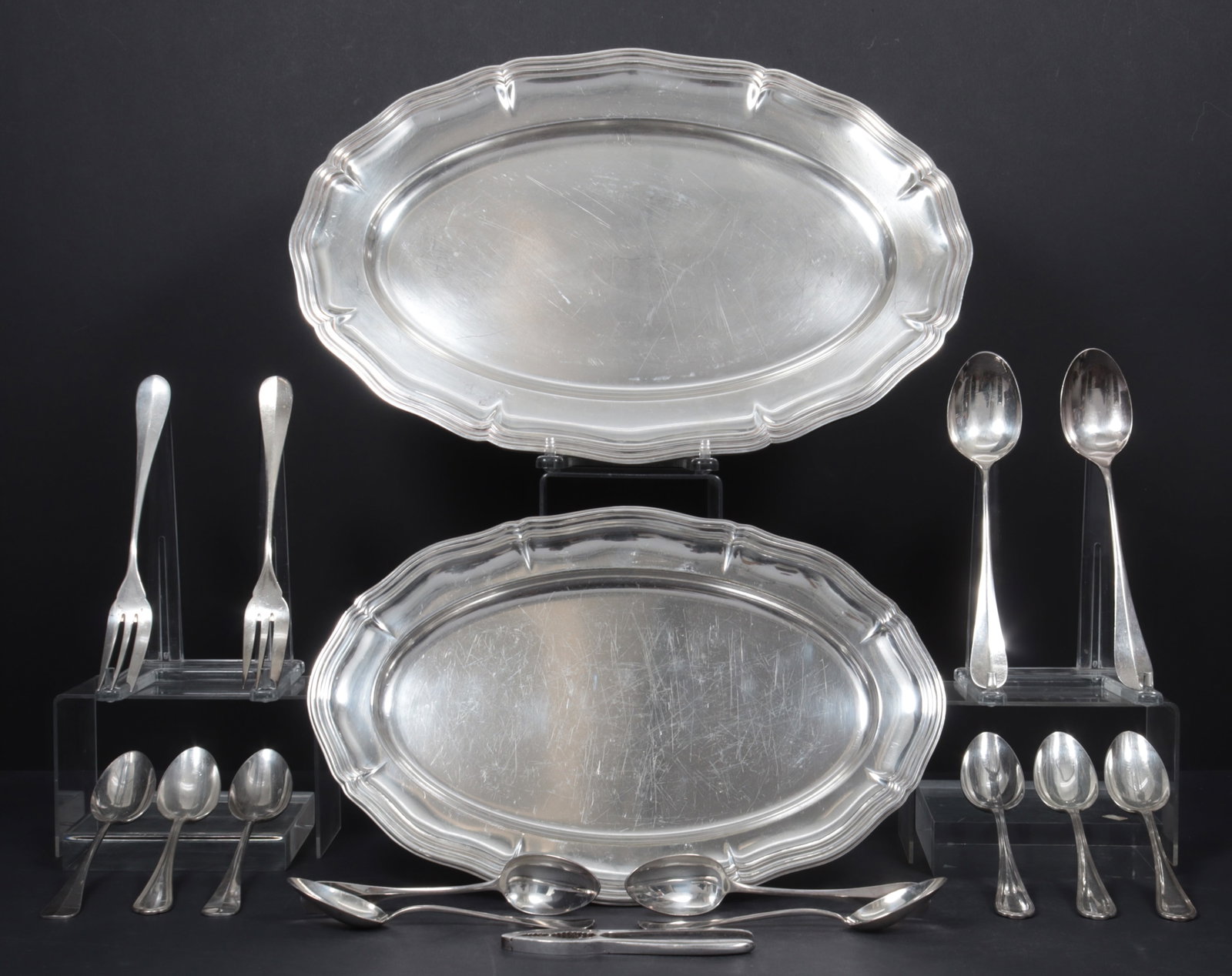 Christofle Trays & Serving Flatware: A group of Christofle silver-plated flatware and trays. Comprising: four Spatours serving spoons, four Fidelio tablespoons, two Fidelio serving spoons, two Fidelio salad serving sets, nutcracker, and