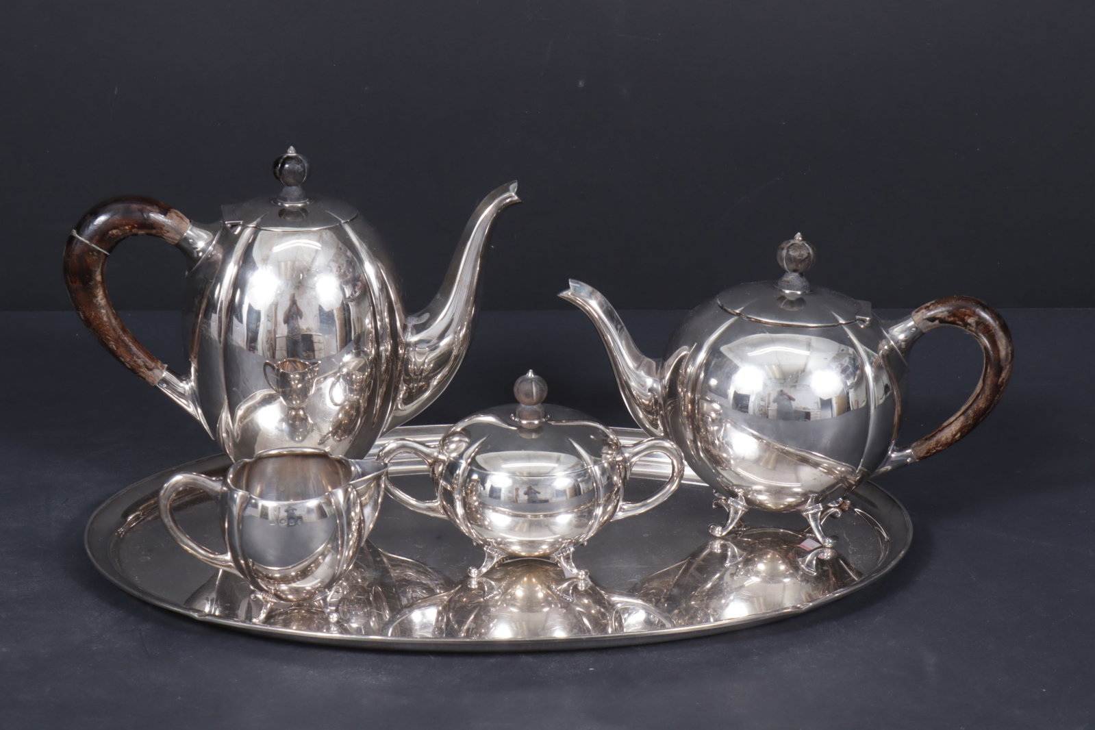 Herman Hooijkaas Sterling Tea & Coffee Service: Herman Hooijkaas of Schoonhoven, Netherlands, Dutch .833 sterling silver tea and coffee service comprised of coffeepot, teapot, lidded sugar bowl and creamer along with oval serving tray, all marked (