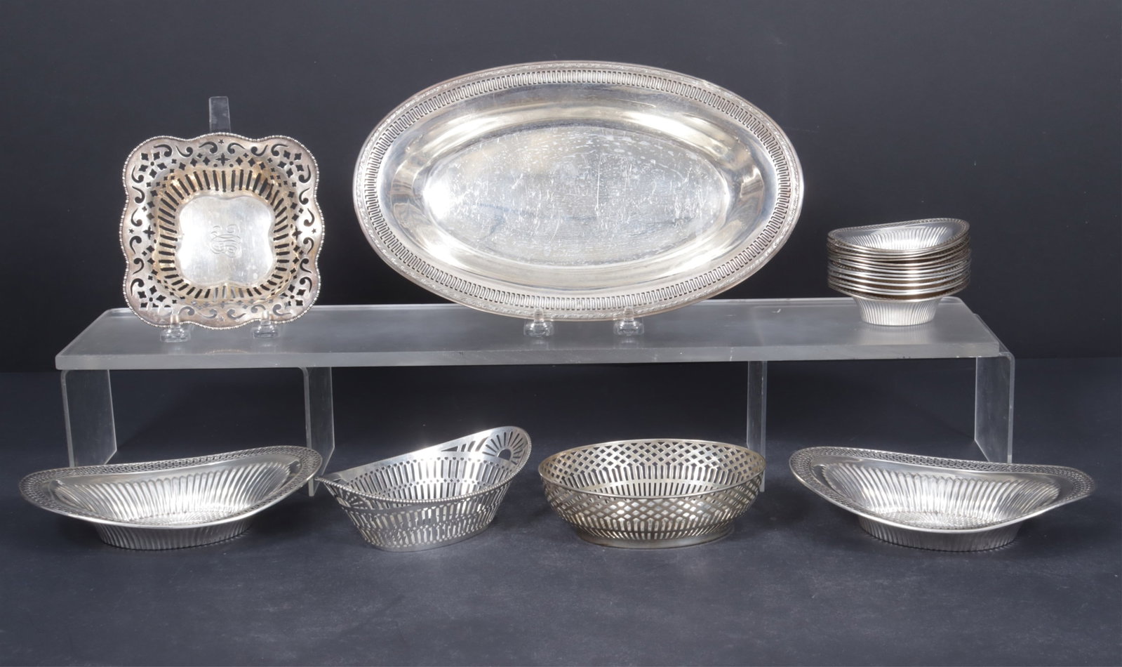 Dutch & American Sterling Silver Serving Pieces: Lot of 19 Dutch and mostly American sterling silver reticulated oval and square serving trays and bowls, includes a small Dutch .835 oval reticulated basket, marked AP; a J.M. van Kempen & Zonen c.191