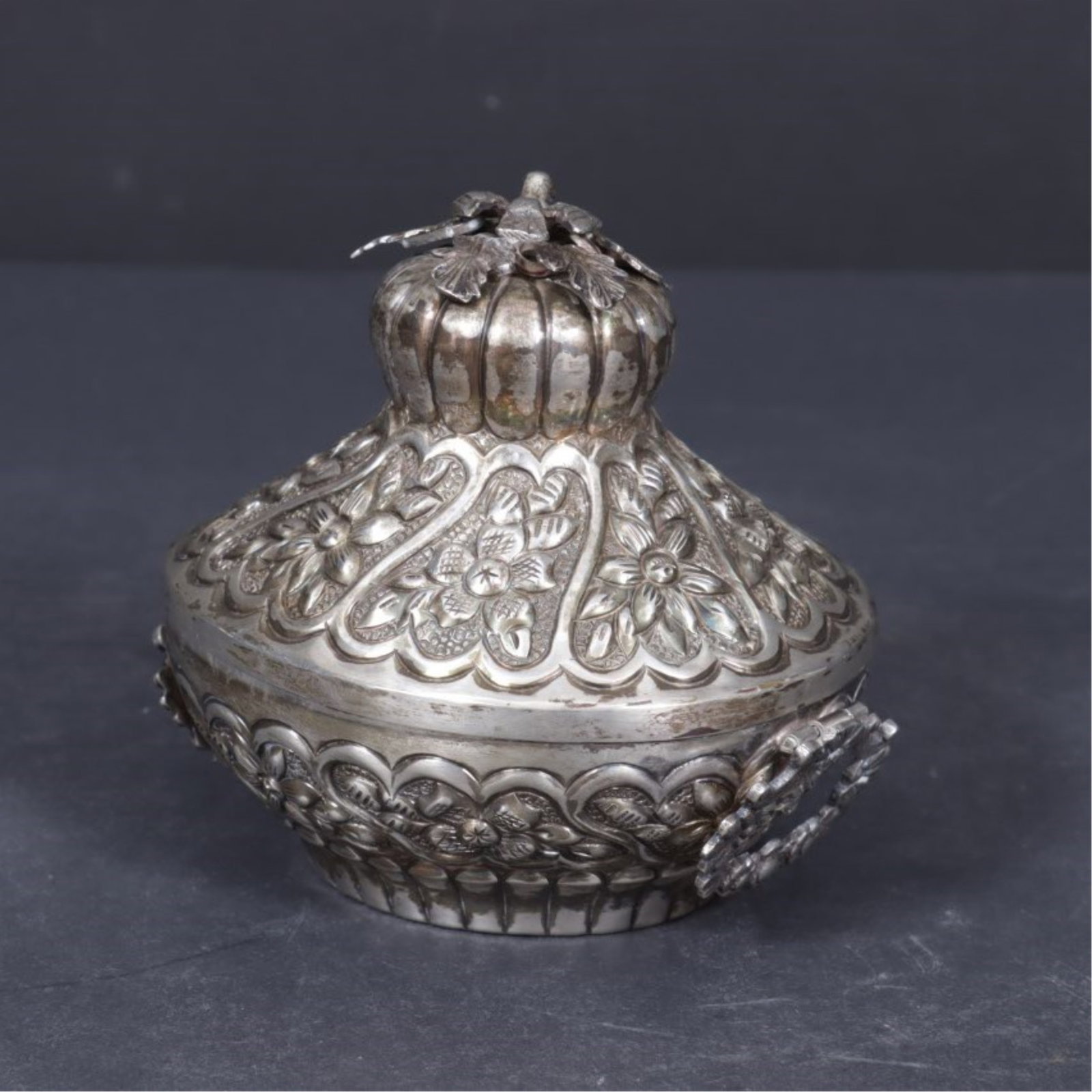 Egyptian Sterling Silver Repousse Bowl: Early 20th C Egyptian sterling silver repousse oval hinge lidded bowl, floral motif throughout surmounted with winged bird and leaf, total weight 9 ozt. 4.5 H x 5.25 W x 4.25 D
