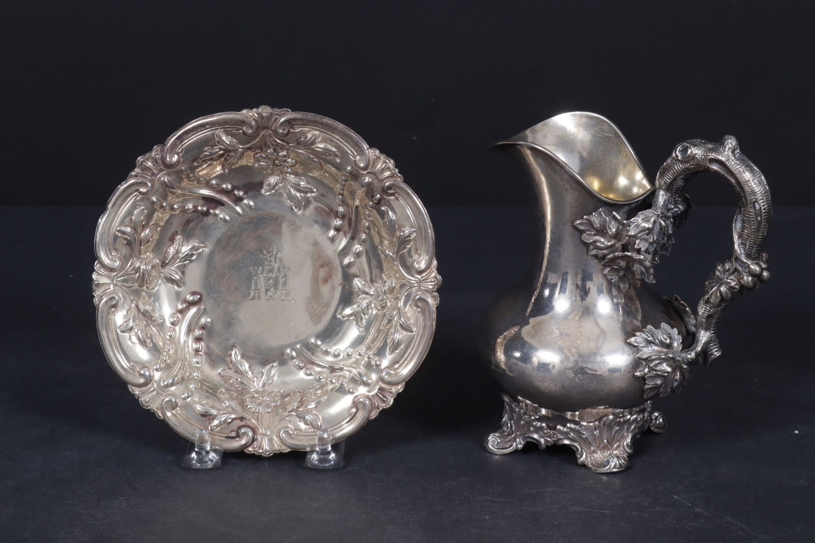 George III, John Langford II & John Sebille Bowl: George III, John Langford II & John Sebille London Repousse bowl, center with castle armorial; along with a Gustaf Mallenborg.830 branch and leaf motif handled pitcher, leaf scroll feet total weight