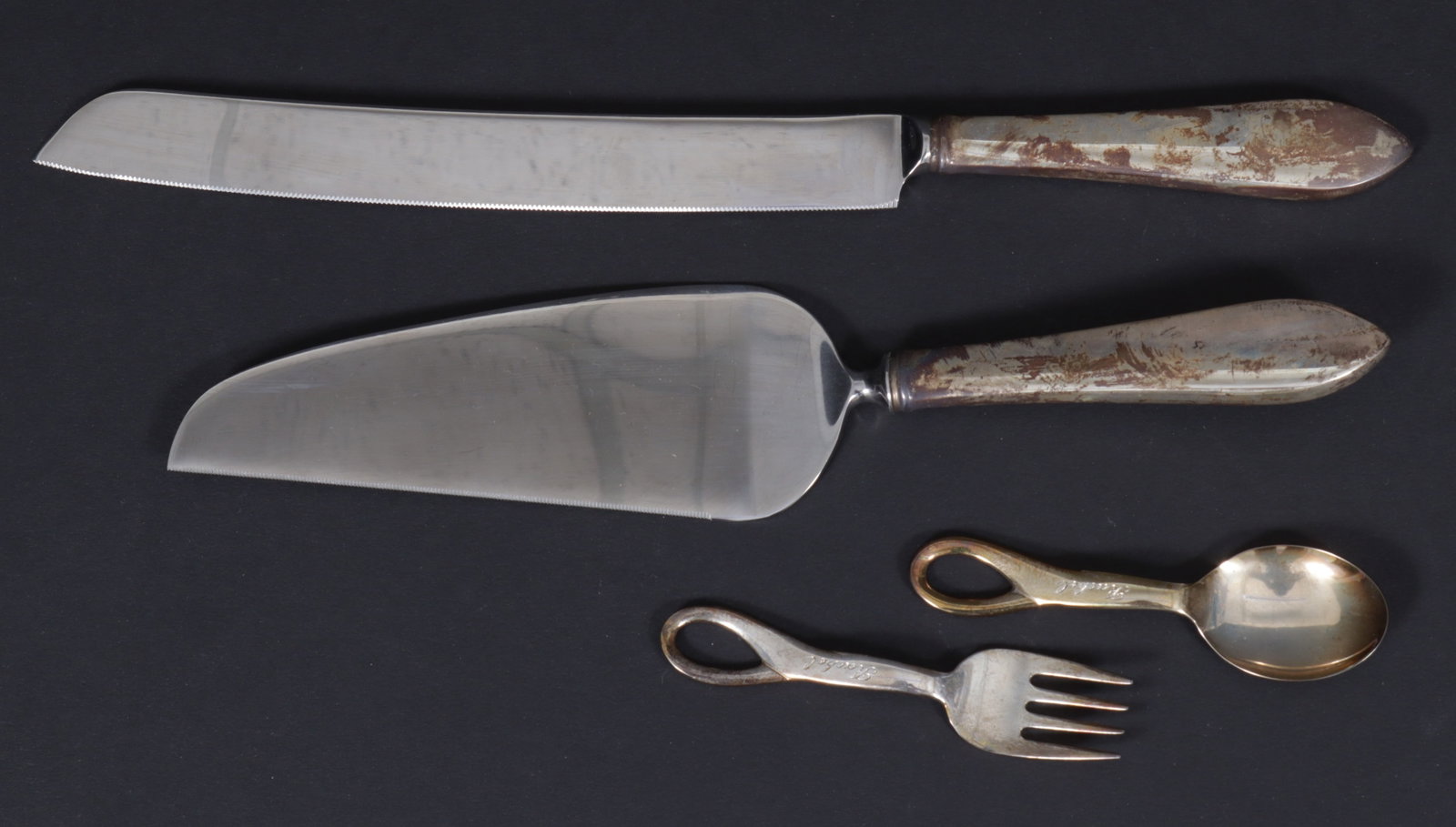 Tiffany & Co. Cake Set & Elsa Peretti Padova Set: Elsa Peretti for Tiffany & Co. Padova baby fork and spoon set, boxed with pouch, monogrammed Rachel; Tiffany and Co. sterling handled cake knife and server in box, Peretti weight 3 ozt. Boxes 1.75 H x