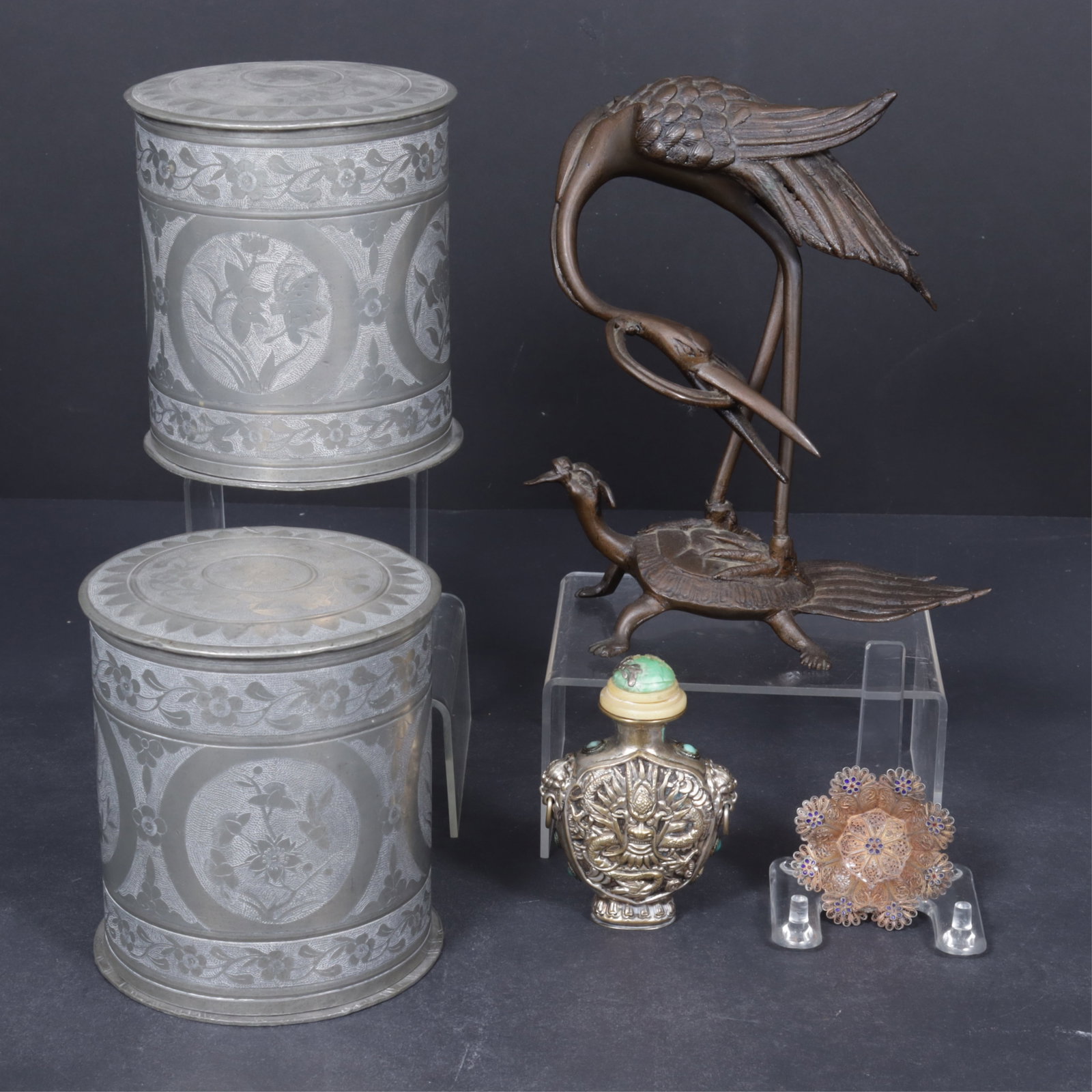 Asian Metal & Stone Objects: Group of Asian metal and stone objects, includes two Chinese export Swatow canisters, engraved with floral and bird motifs; a Japanese Meiji style metal sculpture of a crane and tortoise, unmarked; a
