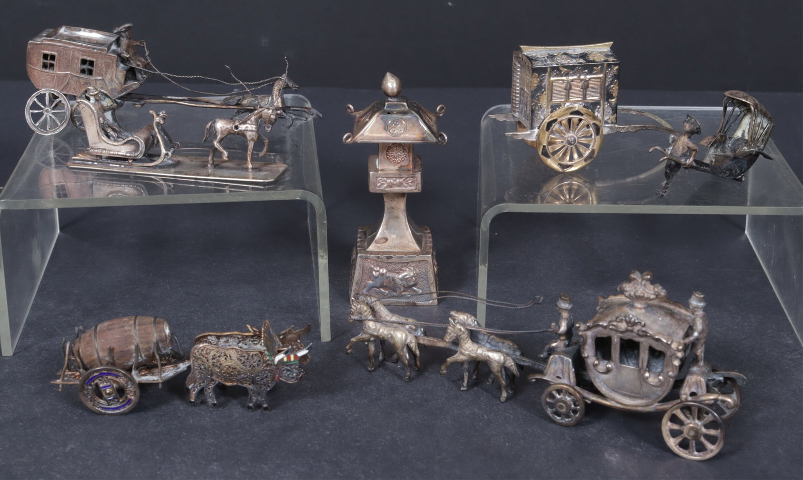 Sterling Silver Horse & Carriage Miniatures: Group of six Dutch and Asian sterling silver miniature figures includes three Dutch; a galloping horse with stage coach; four trotting horses with stagecoach, marked Amsterdam; a trotting horse with s