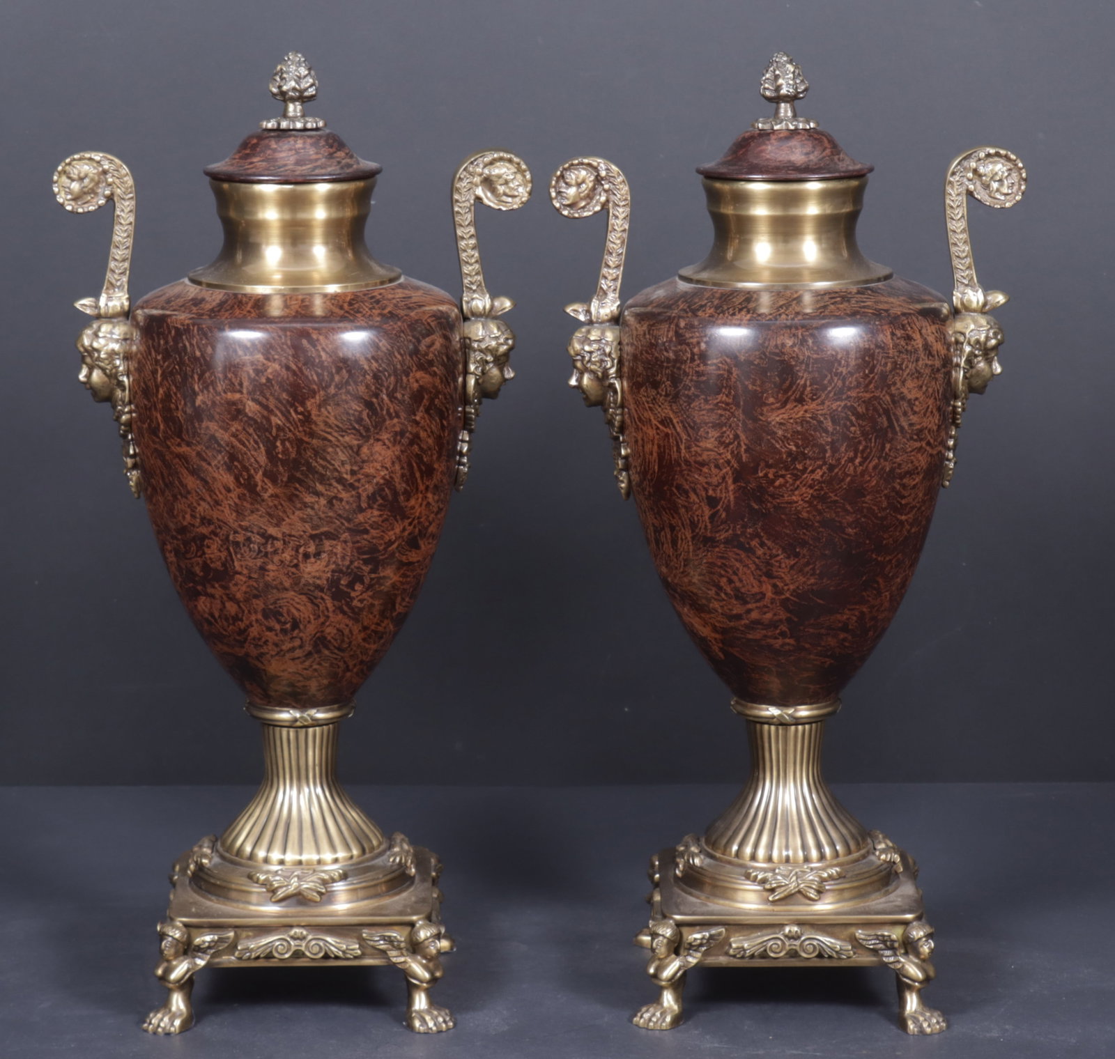 Pair Classical Style Brass Urns: Pair of classical style faux grain painted brass urns. 18" H