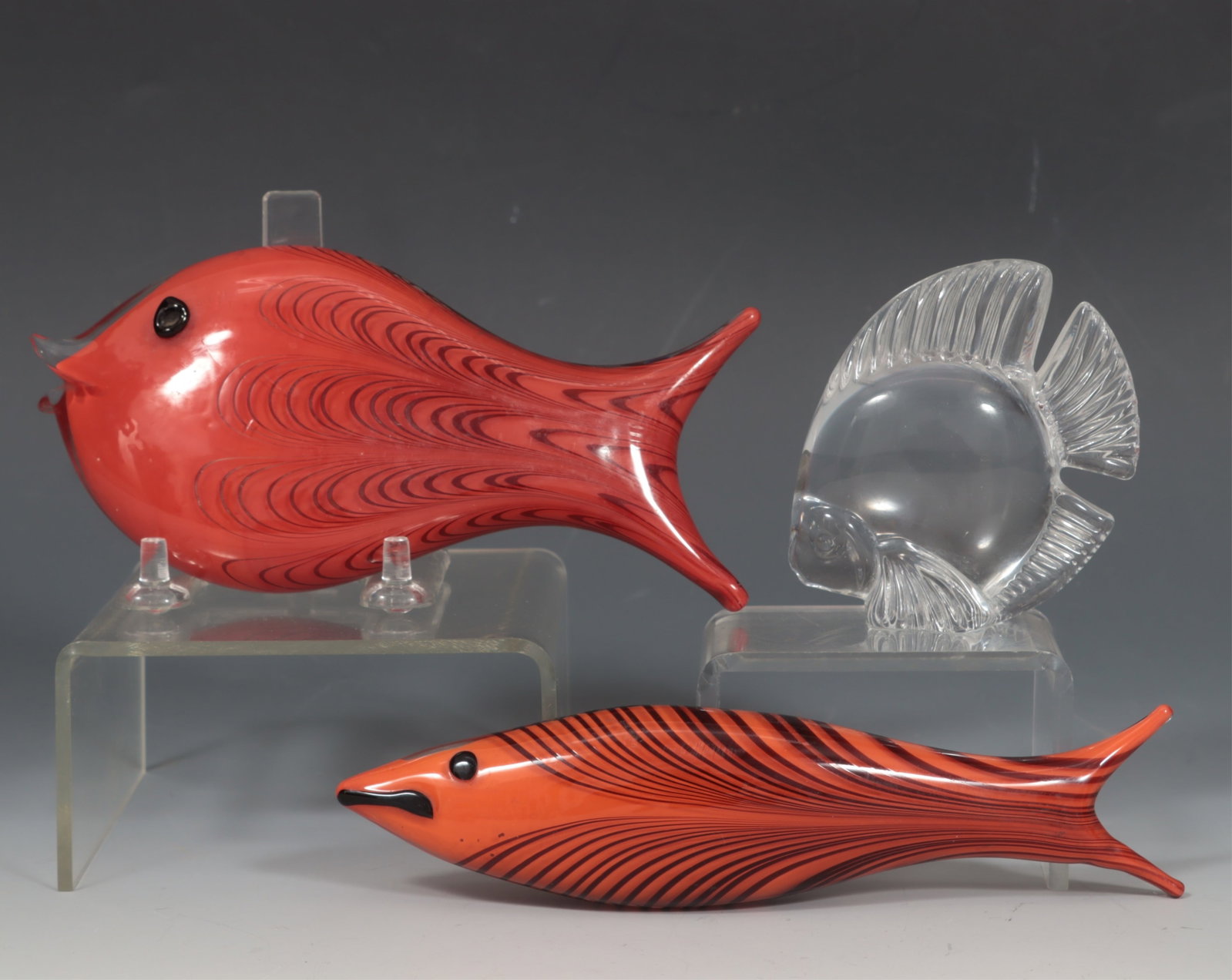 Two Ken Scott Art Glass Fish for Venini Italia: Ken Scott, American, 1919-1991, two art glass Fish for Venini Italia, internally decorated glass, each inscribed Venini Italia along with a Daum France standing glass fish, base inscribed Scott fish 7