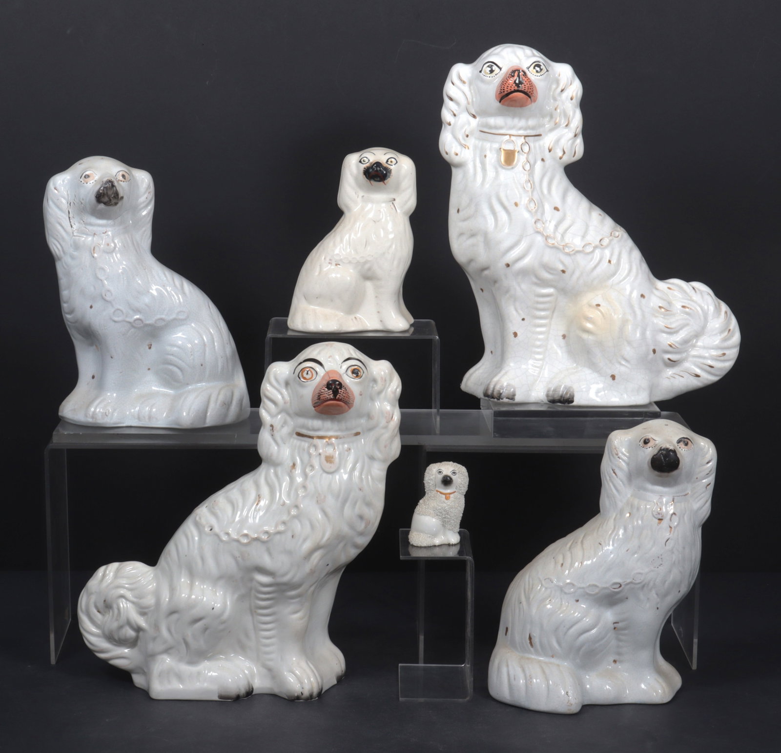 Six Staffordshire Dogs, 19th C.: A group of six Staffordshire dogs, 19th C. Largest 12.75" H