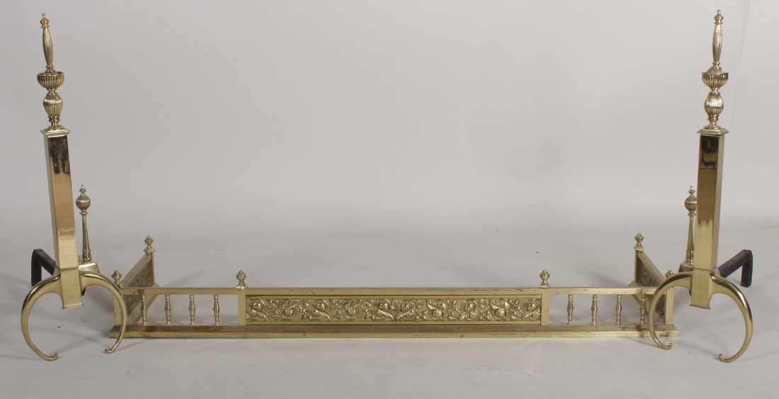 Brass Fireplace Fender with Pair of Andirons: Brass Fireplace Fender together with a pair of brass andirons. (3 pcs) (RFER7233) {WK} Dimensions:Fender: 49 L x 13 W Condition:Use wear, otherwise good. Property from Greenwich, Connecticut.