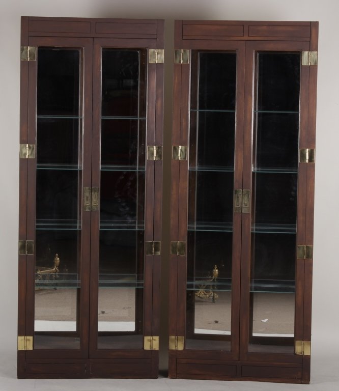 Philip Reinisch Company Lighted Curio Cabinets, 20: Pair of Philip Reinisch Company Lighted Curio Cabinets, 20th C., brass,wood and glass, back bears makers stamp(2 Pcs) (CROS7100/2) {MM} Dimensions:76 1/2"H x 30 1/4"W x 11 1/2"D Condition:Light scratc