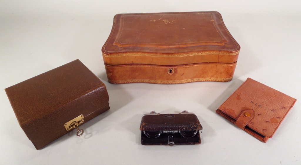4 Vintage Mark Cross Items: Boxes and Glasses: Three Vintage Mark Cross Leather and Ostrich Cases and Folding Opera Glasses: the largest a hinged box with lift out green leather tray; a smaller box with fold out trays, the smallest an ostrich mani