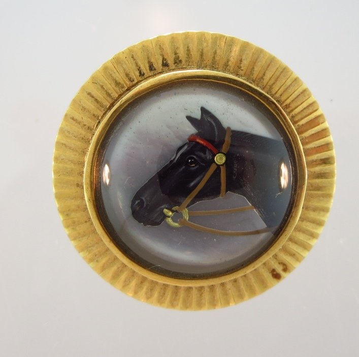 Reverse Crystal of A Horse Head, Edwardian: Reverse crystal of a horse head backed with mother of pearl, set in a gold mount. English circa 1900. (PASA7505) {WT}(PASA) Dimensions:1" diameter Condition:Good condition From a Private NYC Collectio
