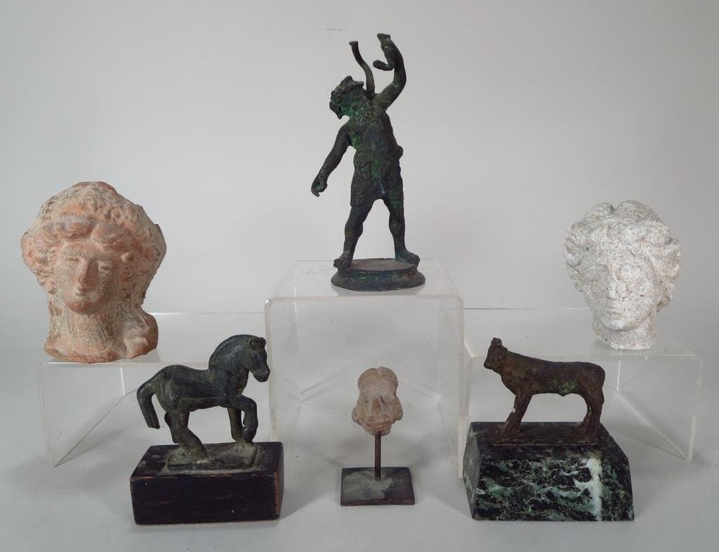Group of Ancient Artifacts from Various Cultures: Group of ancient artifacts from various cultures including an Egyptian bronze Apis Bull, c. 600 BC, a Roman bronze Bacchus and a Horse, c. 200 AD, a Roman stone head of a Woman, c. 200 AD, a South Ita