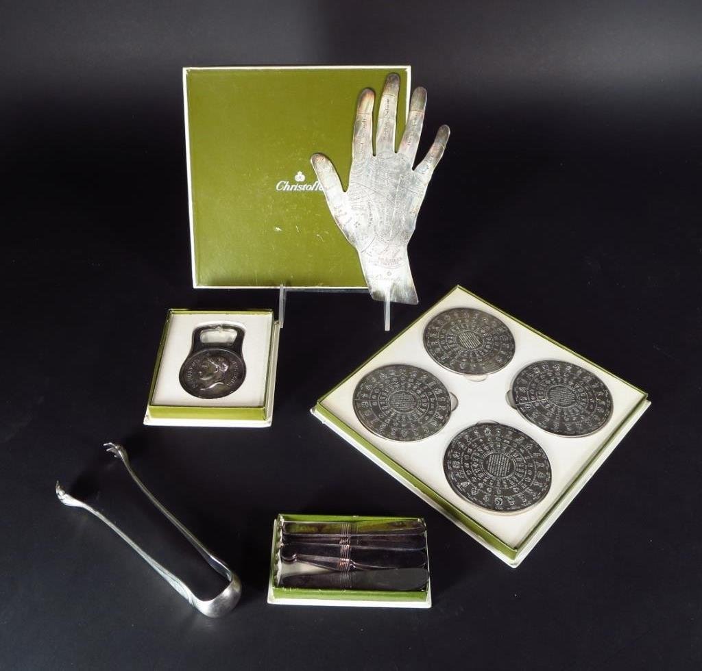 Christofle: Napoleon, Pats, Tongs, Hand, Coasters: Mixed lot of Christofle silverplate: a Napoleon bottle opener, boxed; set of 6 butter pats, boxed; 4 coasters, boxed; a "Hand of Destiny" and an older monogrammed tongs with hairy claws. (5 pcs.)(CSHO