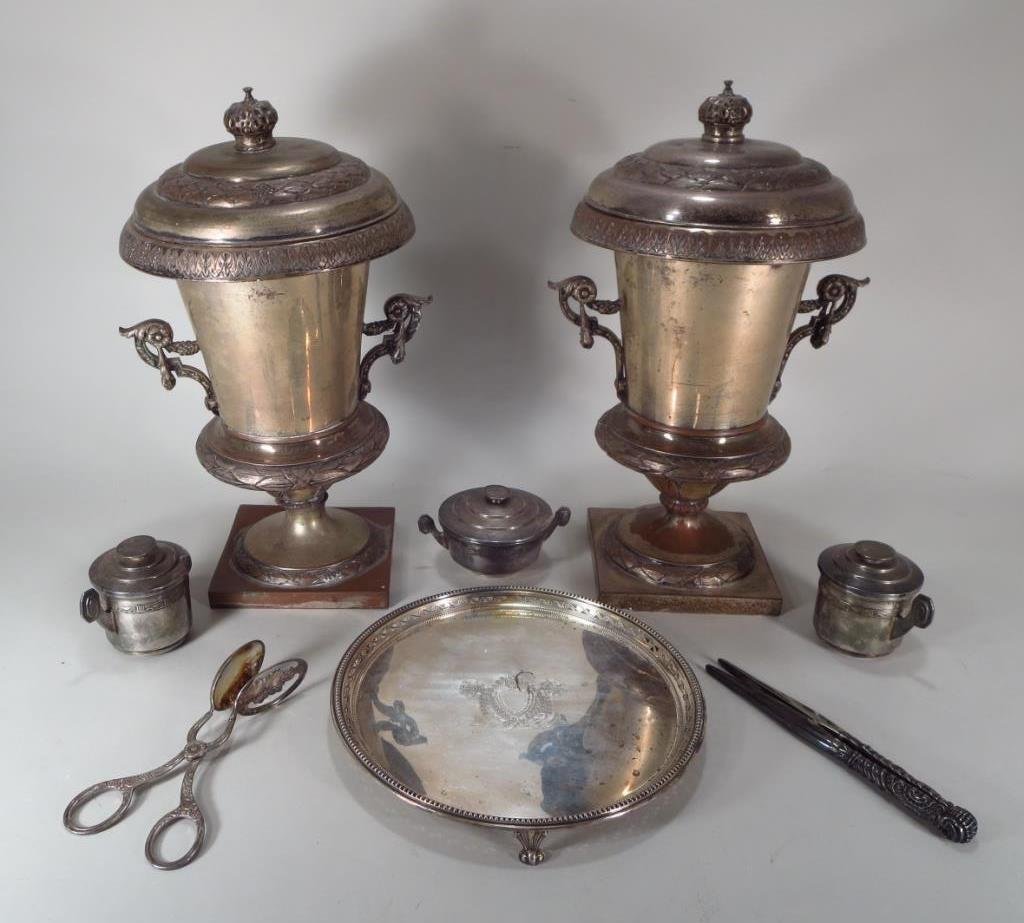 Pair of Ornate Silverplate Wine Coolers: Pair of Ornate Silverplate Wine Coolers. Comprising a pair of covered wine cooler, a salver, salad tongs, a pair of glove stretchers, a sugar bowl and two tea presses.(AFPAT8305/8) Measurements: 16"H 