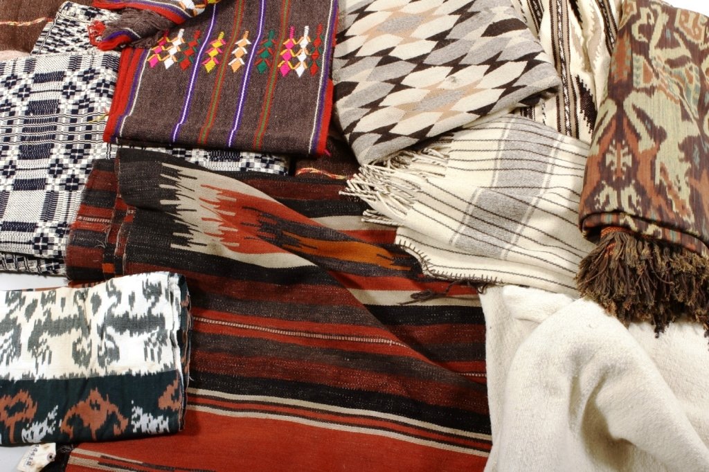 Native American Blankets and Rugs, 20th C.: Nine South West Native American wool rugs and blankets, 20th C., in various designs and colors.(RANDJ8223/10) Measurements: Largest 9 Ft x 4 Ft Condition: Age and use wear, stains and tears. Property 