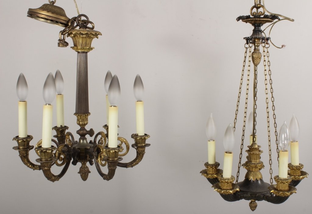 Two Decorative Empire Style Chandeliers: Two decorative empire style small chandeliers, gilt and black metal. one five light hanging from five chains, the other six light with central column.(CSHO8044/2) Measurements: 5 light is 12"W x 30"H.