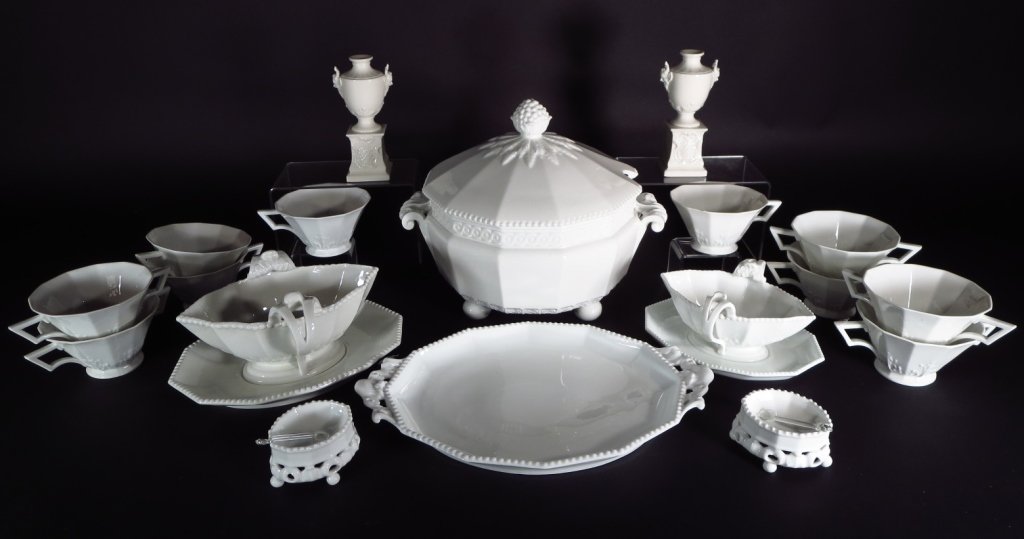 Group of Nymphenburg Porcelain Table Articles: Group of Nymphenburg porcelain table Article German, 20th century. Comprising of 10 two handled cups, 2 urns, a tureen, 2 sauce boats, a tray and 2 open salts with glass spoons.(45E858303/20) Measurem